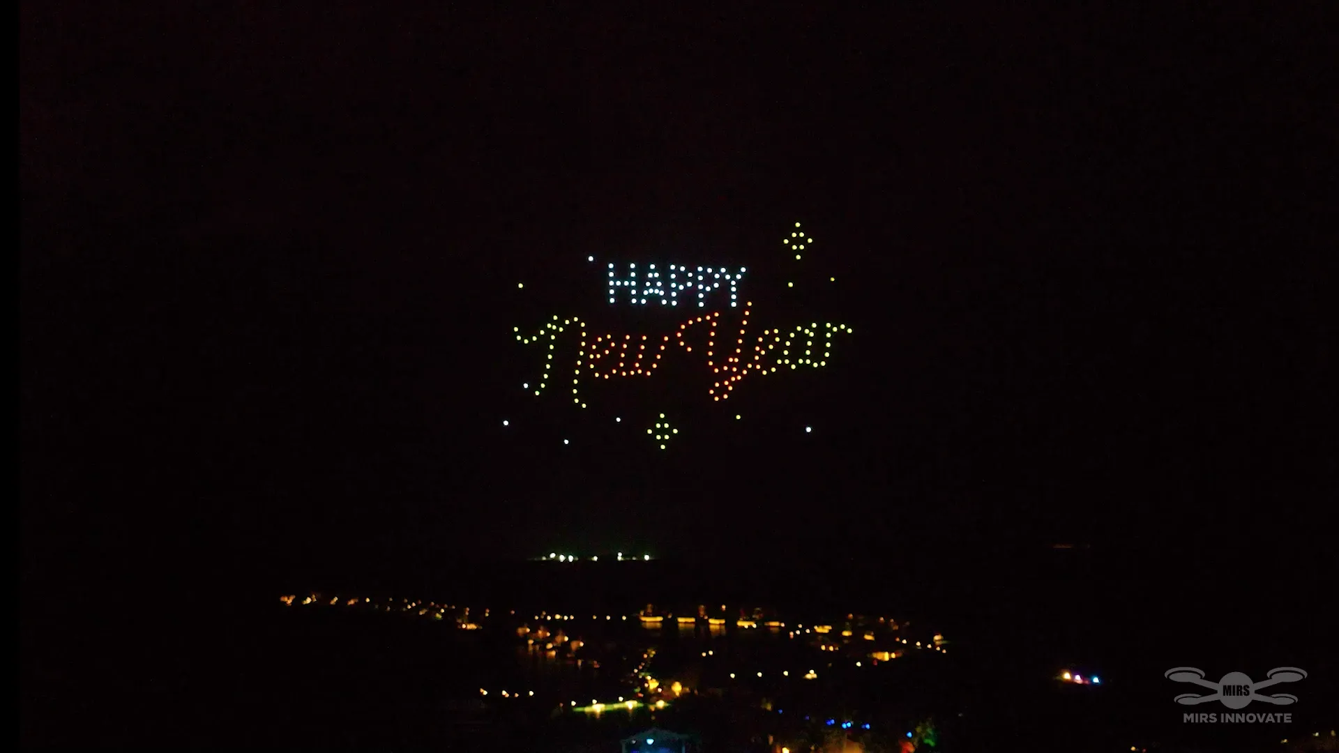 Happy New Year text formation by drones at InterContinental Maldives Maamunagau drone show