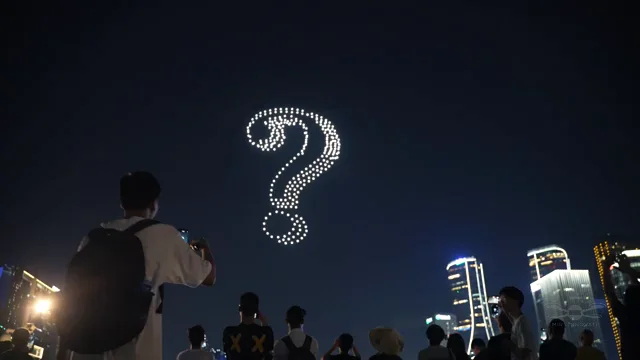 Crowd watching question mark drone formation at Sydney Harbour — Socrates app launch drone light show, Australia