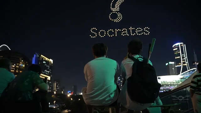 Socrates drone formation seen from shore crowd — Socrates Social Apps drone light show, Sydney Harbour, Australia