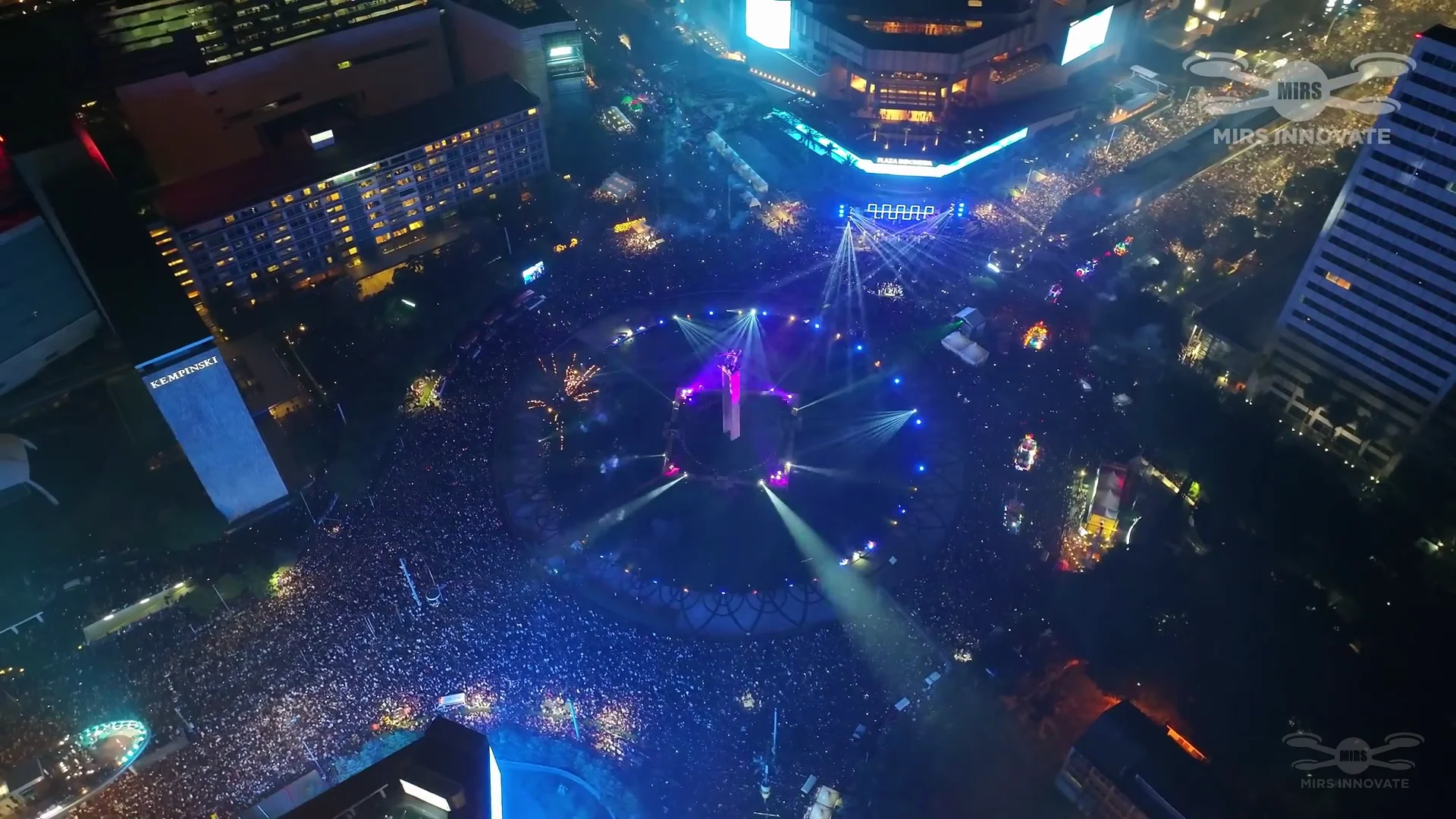 Aerial drones over the Jakarta nightscape during the New Year's Eve drone light show at Bundaran HI — 500 drones