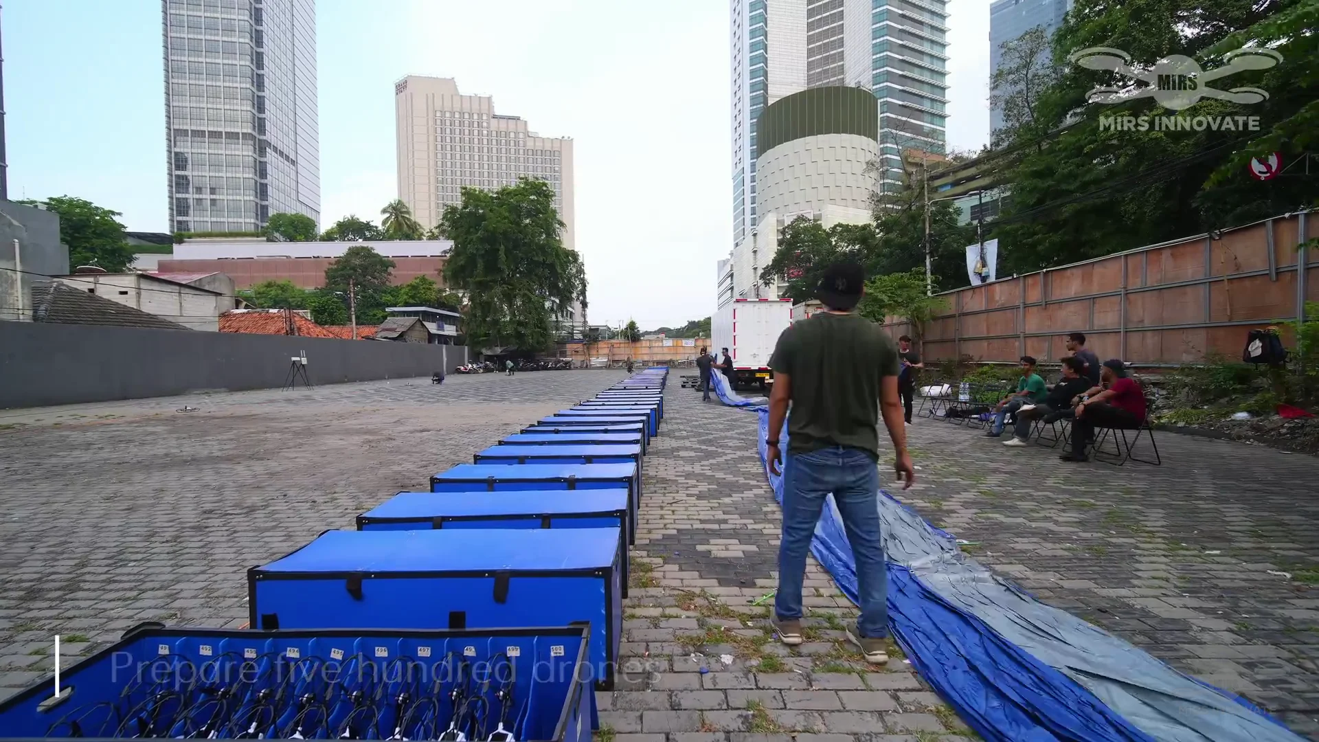 MIRS operations team conducting rooftop drone setup and pre-flight checks for the Jakarta New Year's Eve drone show at Bundaran HI