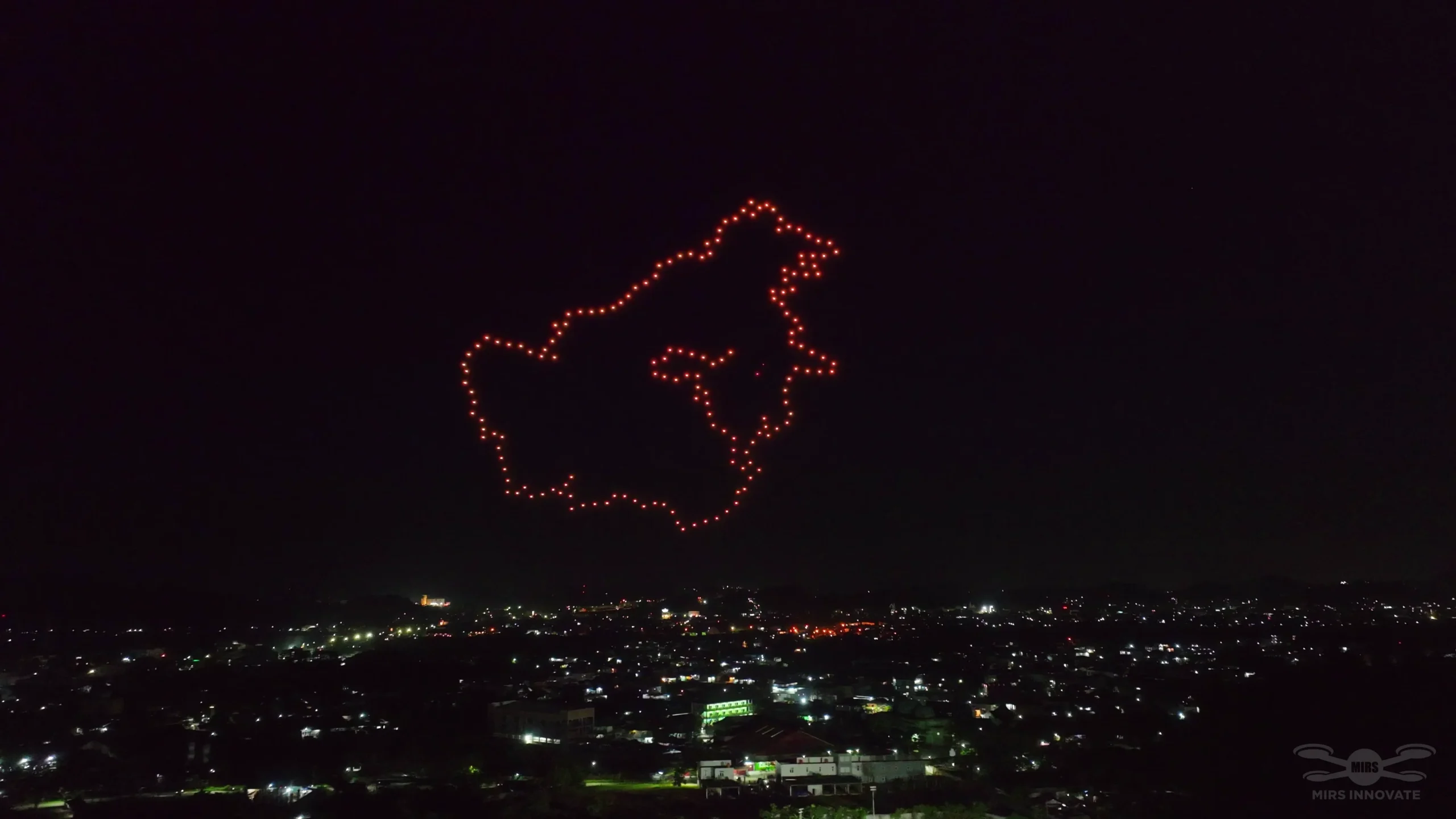 Kalimantan island map drone formation above Samarinda Stadium — 500 drones forming the shape of Borneo island at the MTQN XXX event
