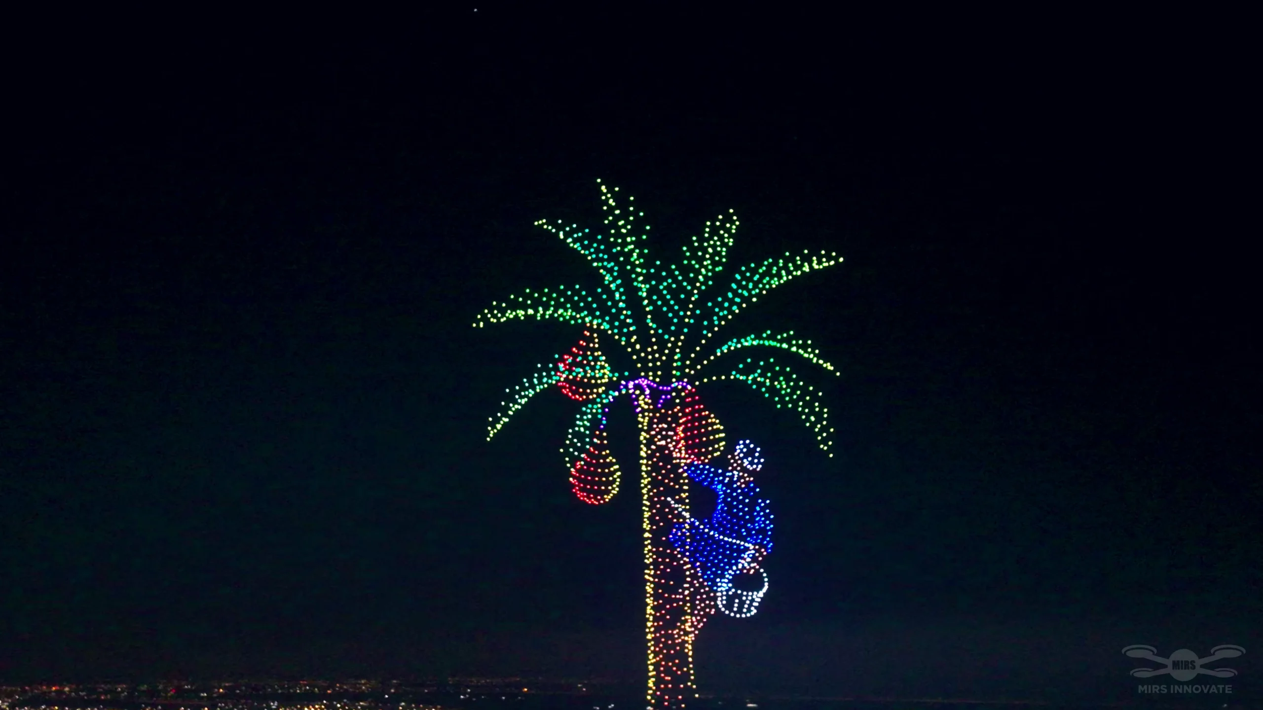 Date palm tree harvest formation at a government celebration drone light show above Basra Stadium, Iraq — 2,000 drones