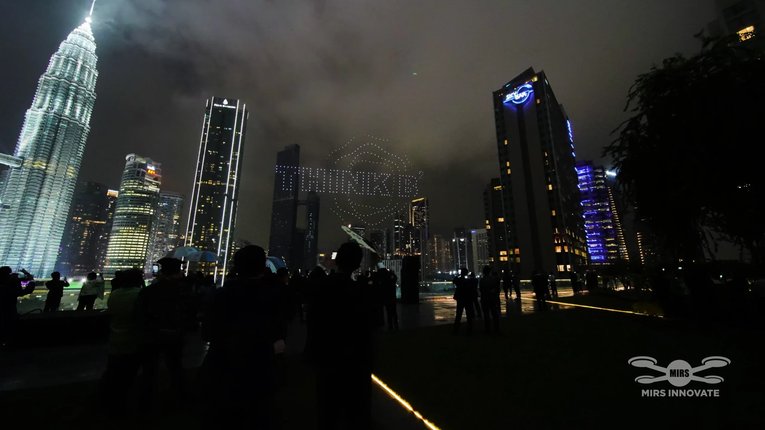 THINK BIG drone text formation above Petronas Twin Towers Deloitte SEA Partners Conference 2024