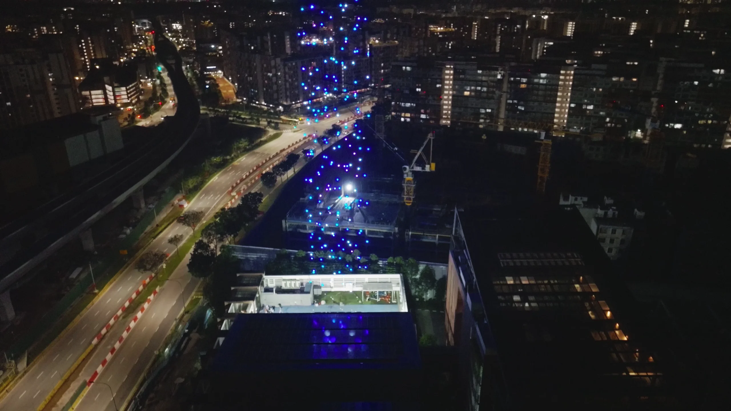 Drone swarm rising above Dulwich College Singapore during Founder's Day 2025