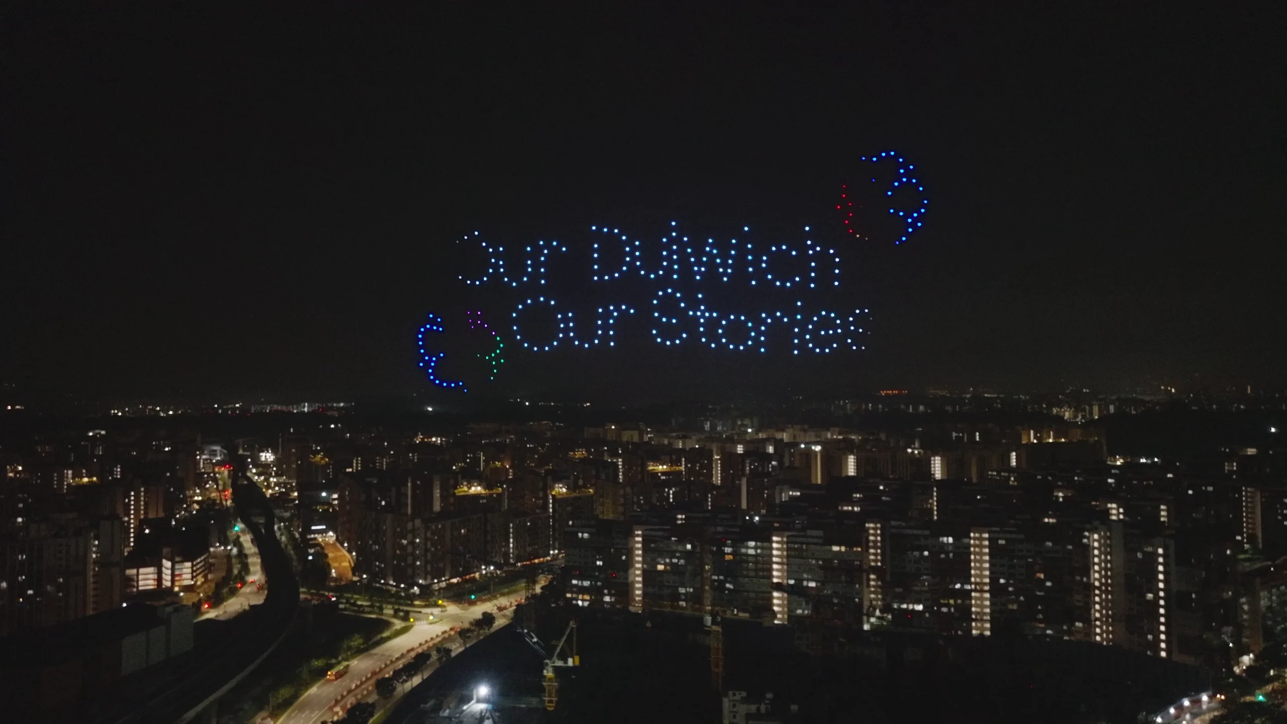 Our Stories text drone formation above Dulwich College Singapore