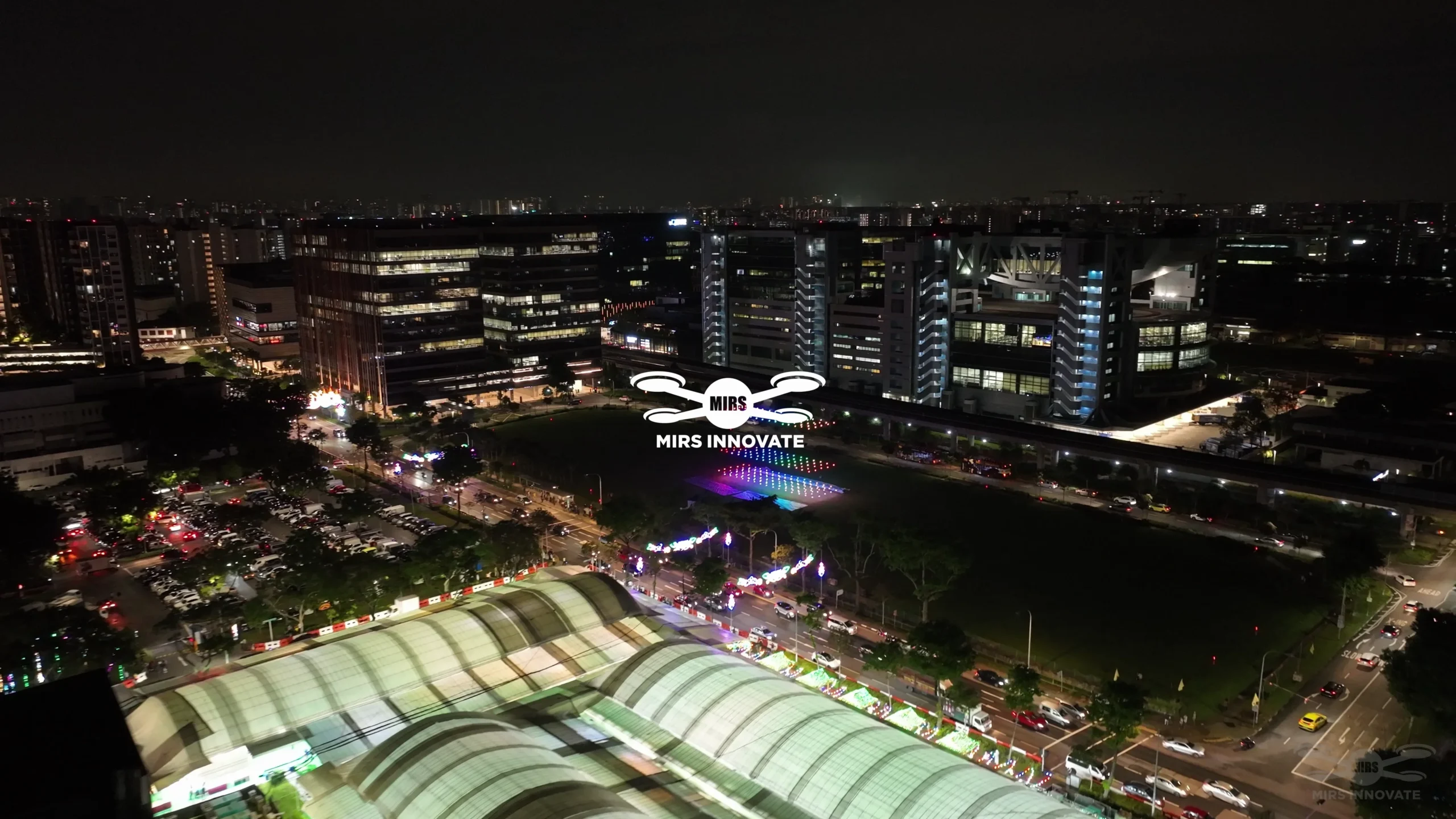 Wide aerial finale of the 300-drone Bazaar Raya show at Geylang Serai