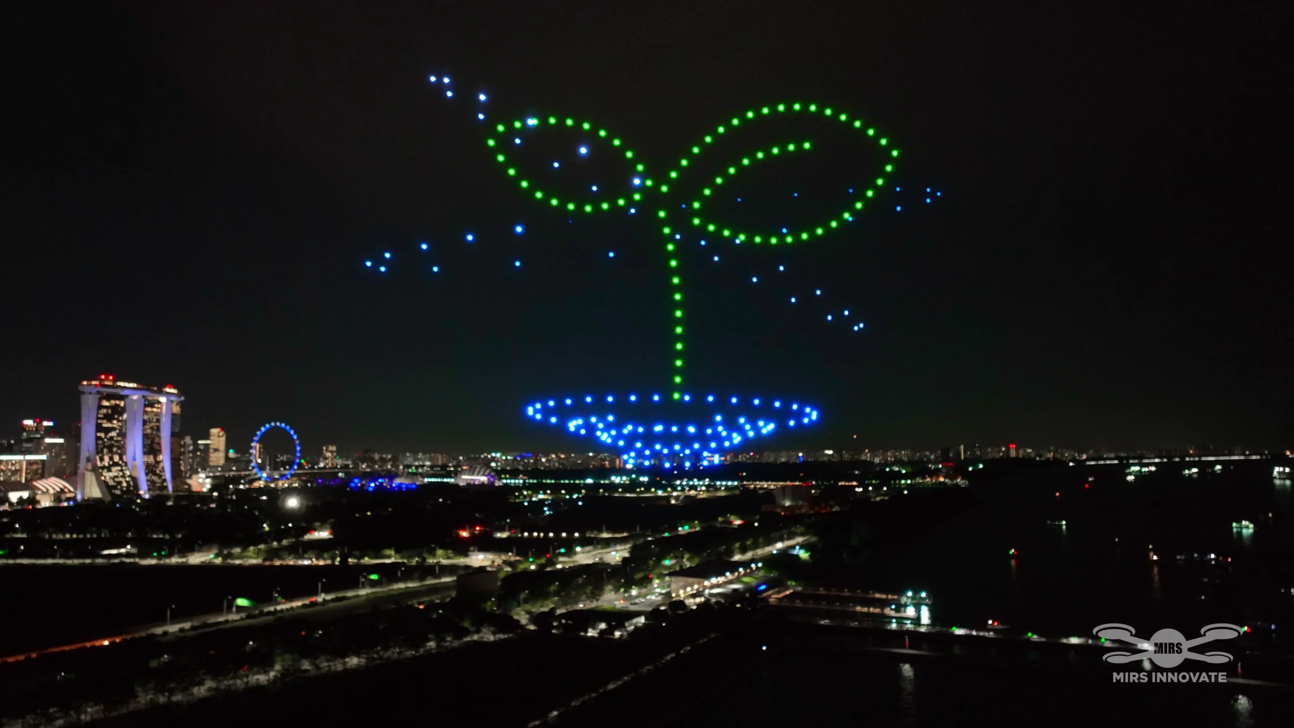 Plant sprout drone formation beside the Singapore Flyer and Marina Bay Sands