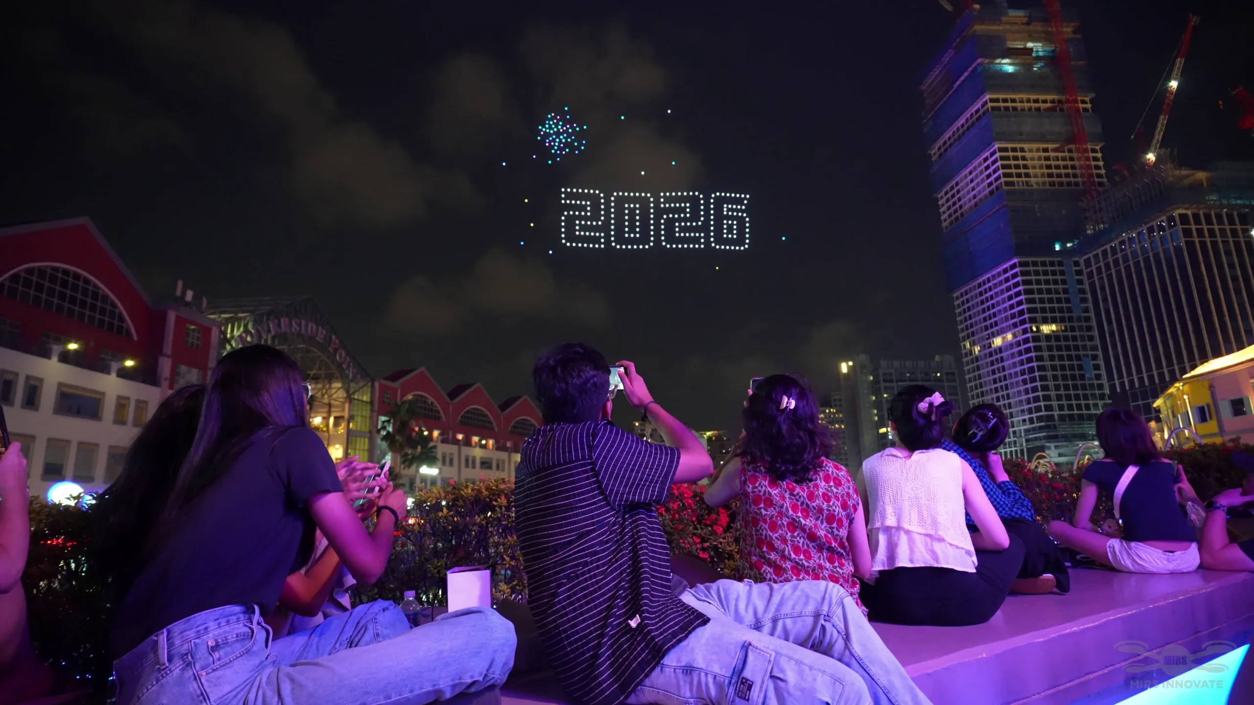 2026 New Year drone formation above crowd at Clarke Quay Singapore