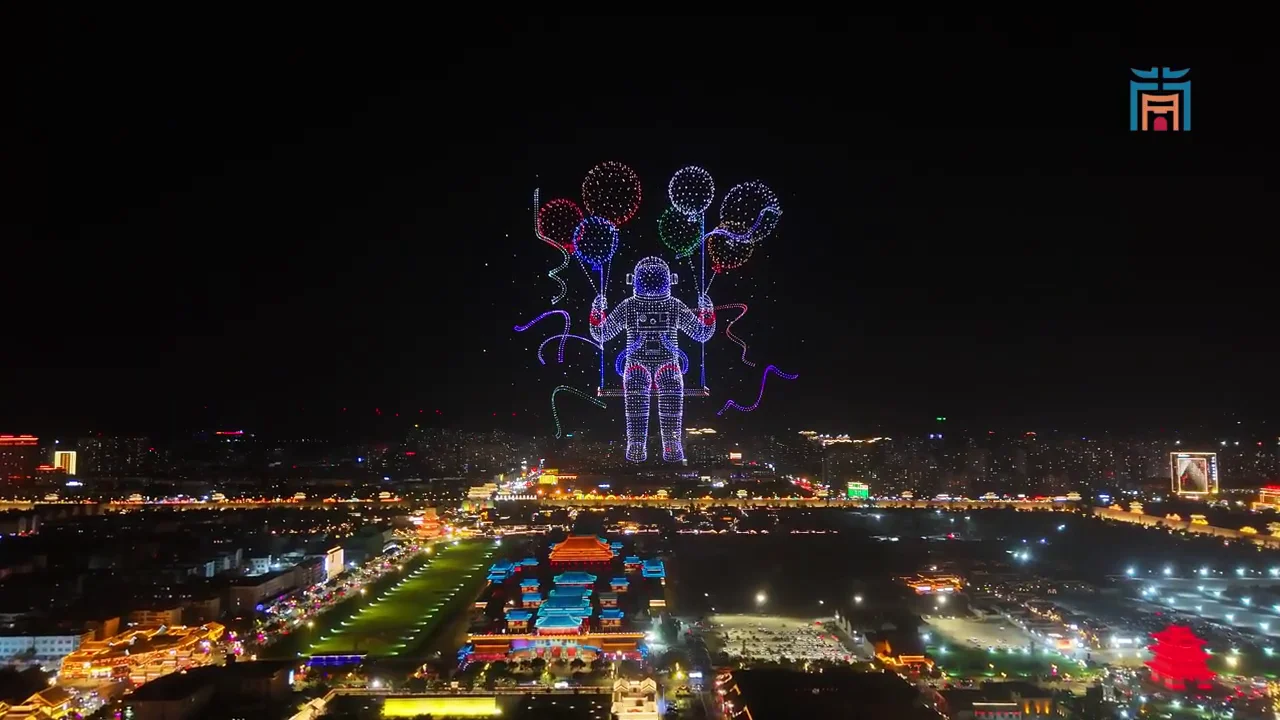Astronaut holding balloons formed by drones above a Chinese city skyline