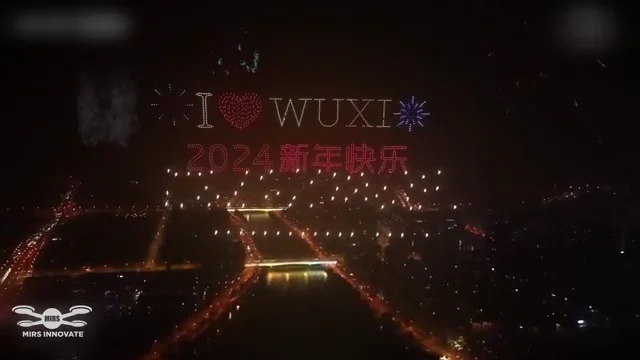 I Love Wuxi and 2024 New Year text formed by drones above the city