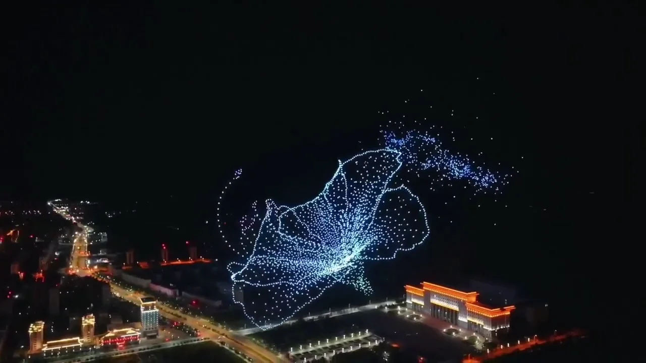 Azalea flower formation above illuminated roads during the Yanbian anniversary display