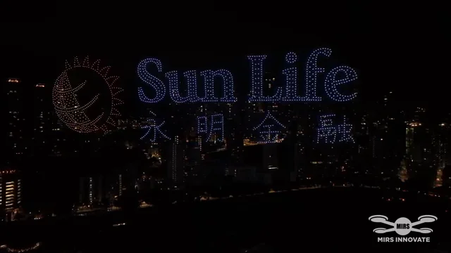 Sun Life logo and Chinese text formed by drones above the Hong Kong skyline