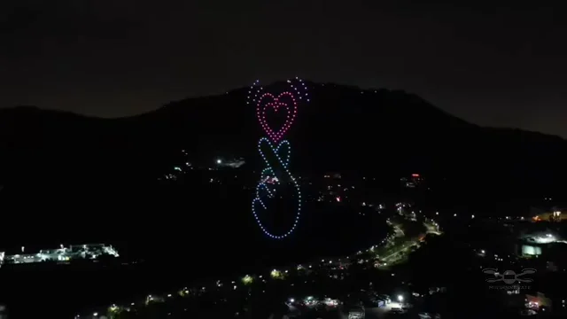 Interlocking heart formation above the city skyline