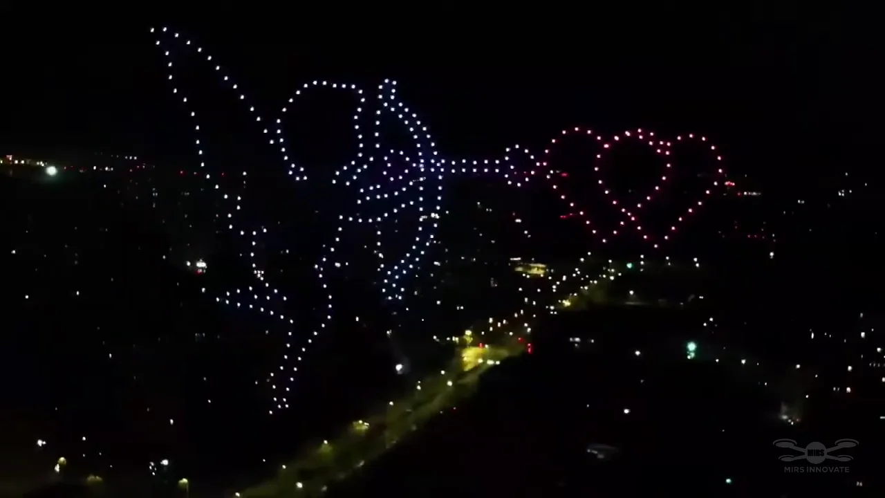 Astronaut holding a heart in a 300-drone overseas proposal show