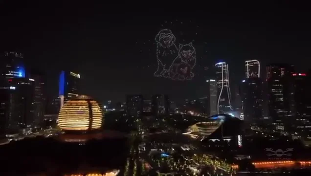 Romantic figures formed by 500 drones above a city skyline