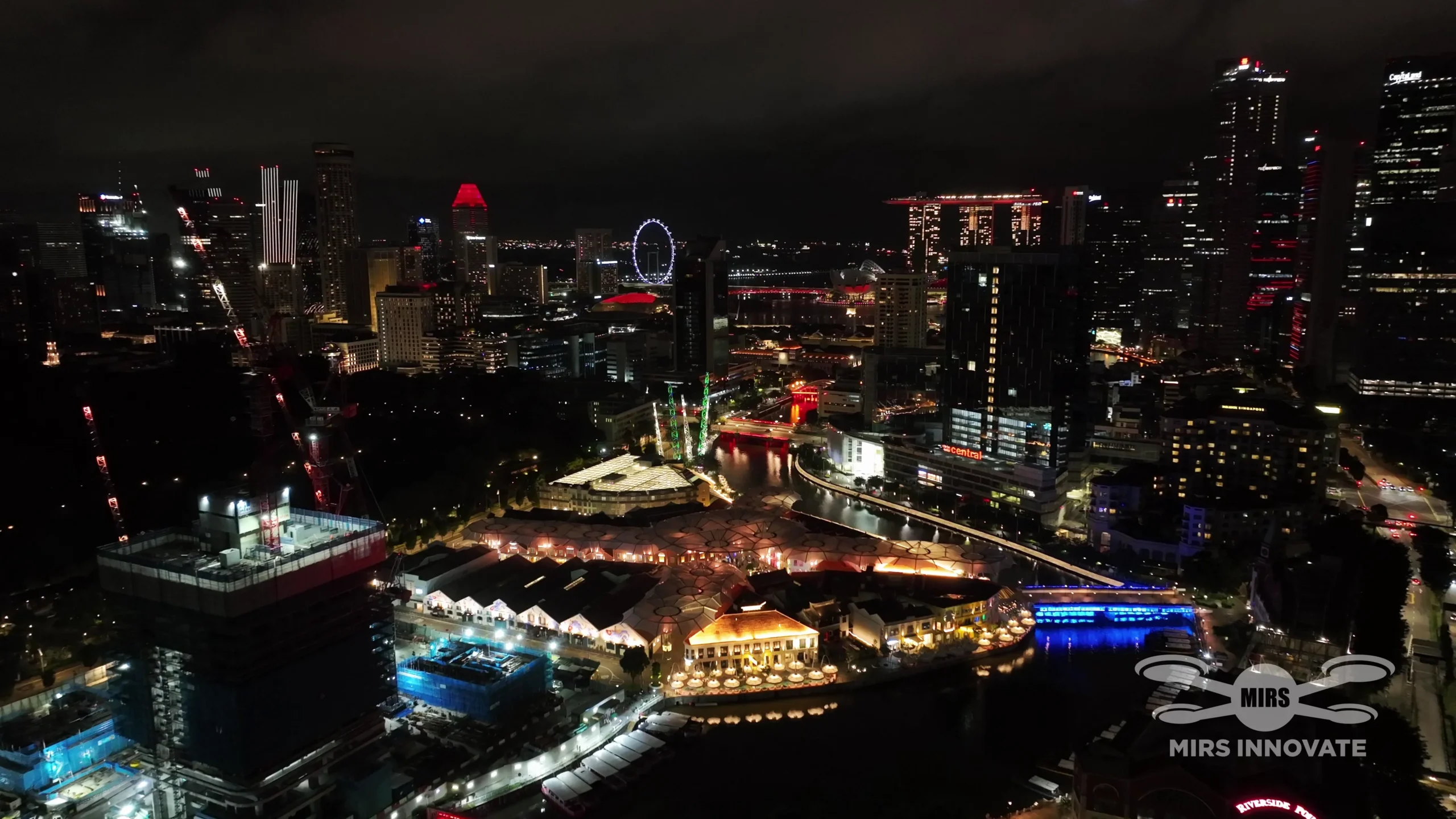 Wide aerial view of CQ Chinese New Year Eve drone show over Singapore River