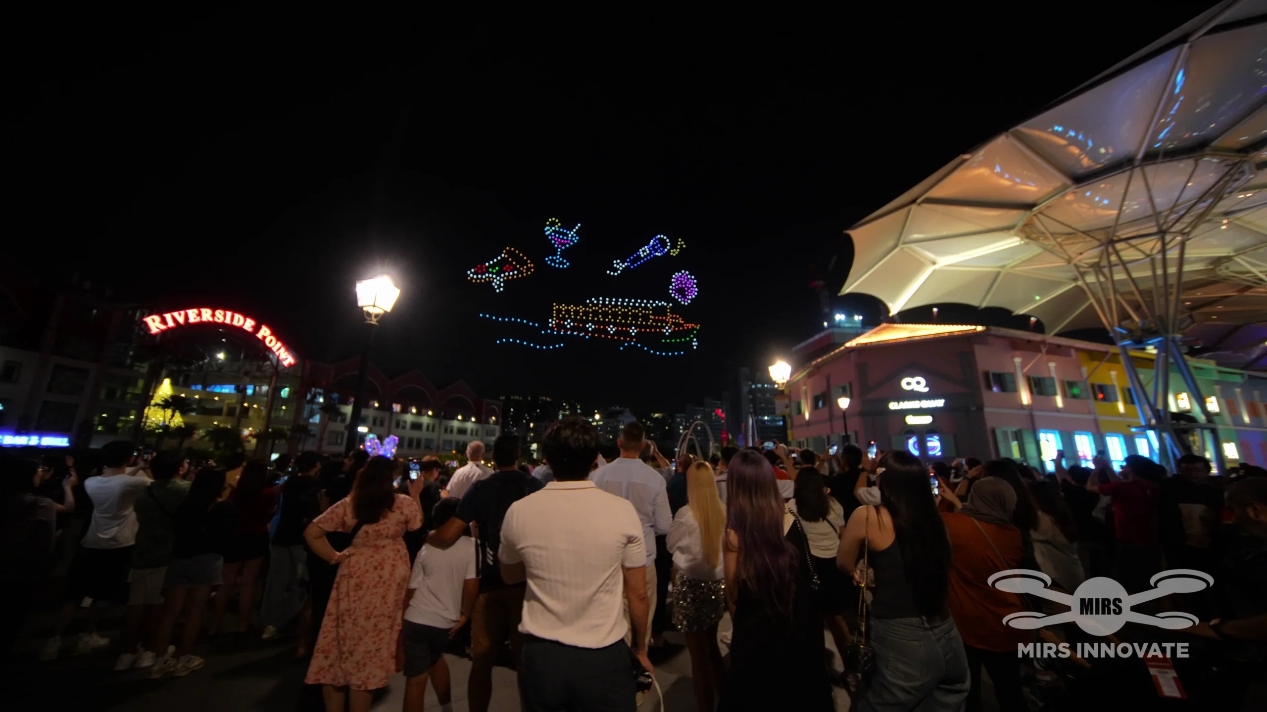 Festive icon drone formations watched by the crowd at Clarke Quay Singapore
