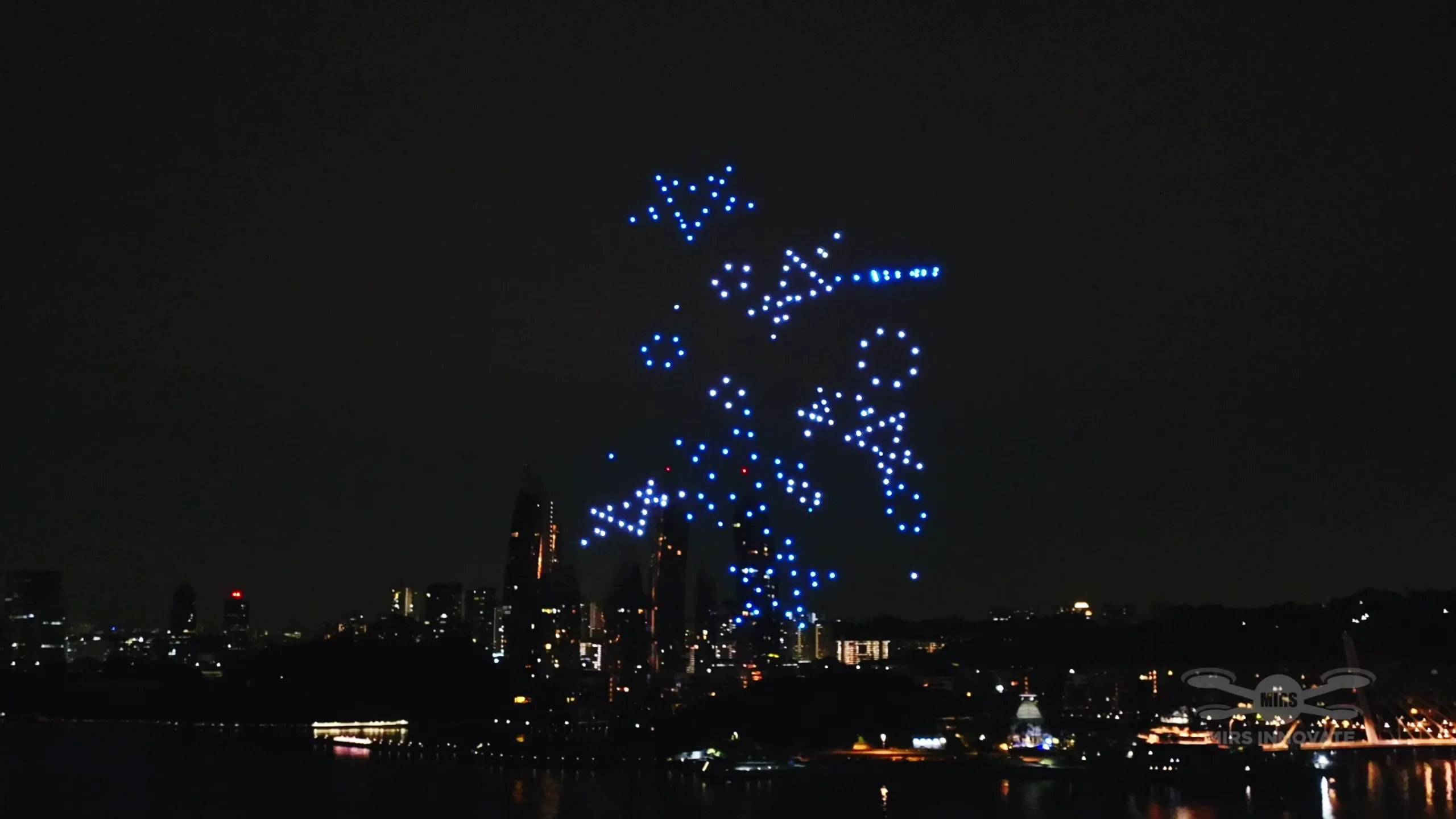 Blue transition formation over Sentosa at the Deloitte Big Bash 2026 drone light show in Singapore