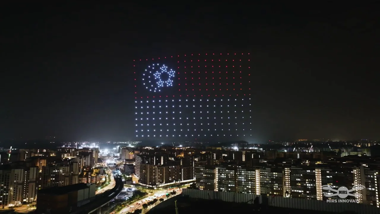 Red and white grid drone formation above Dulwich College Singapore