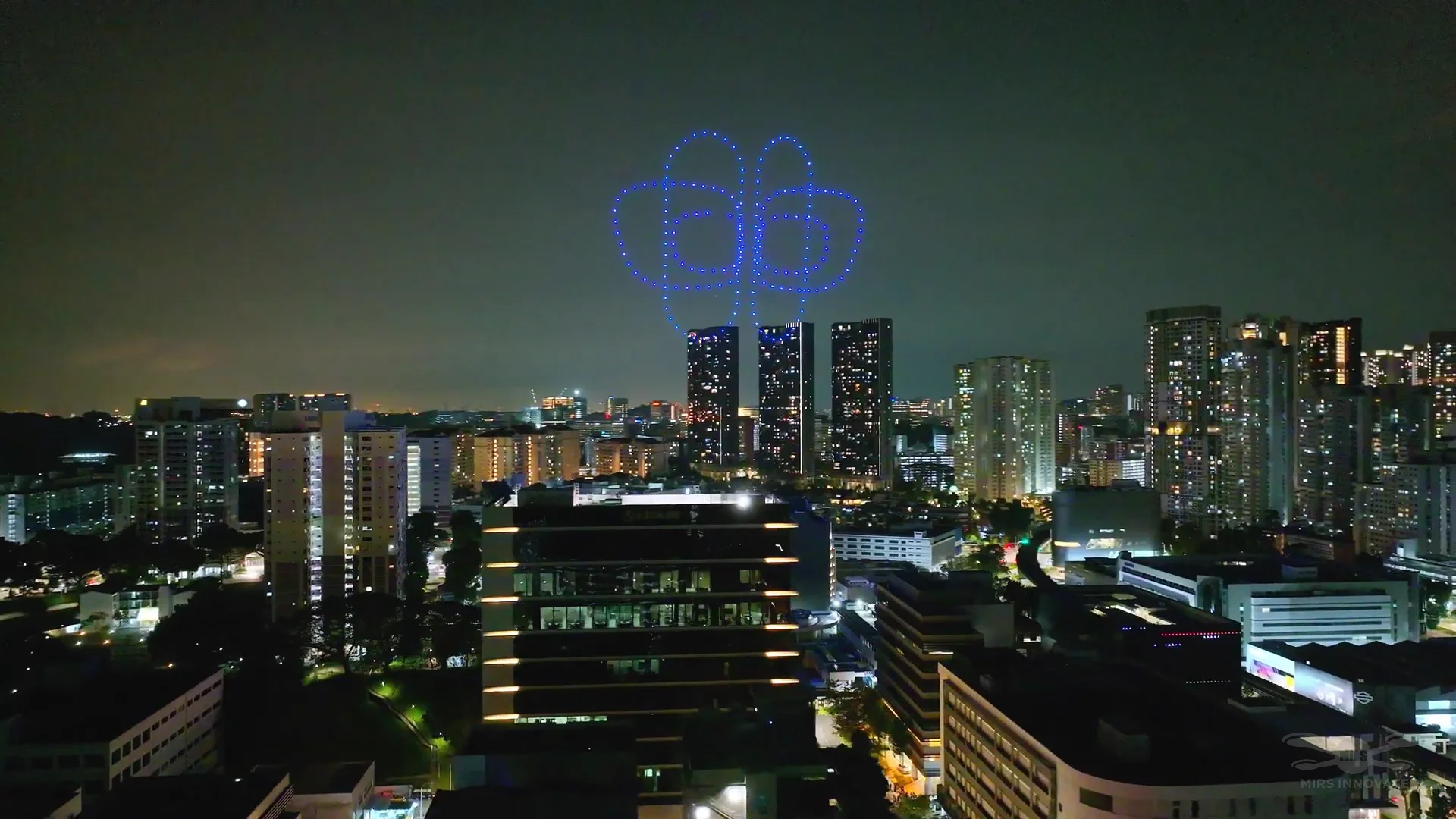 Circular Eurokars logo drone formation above Singapore skyline