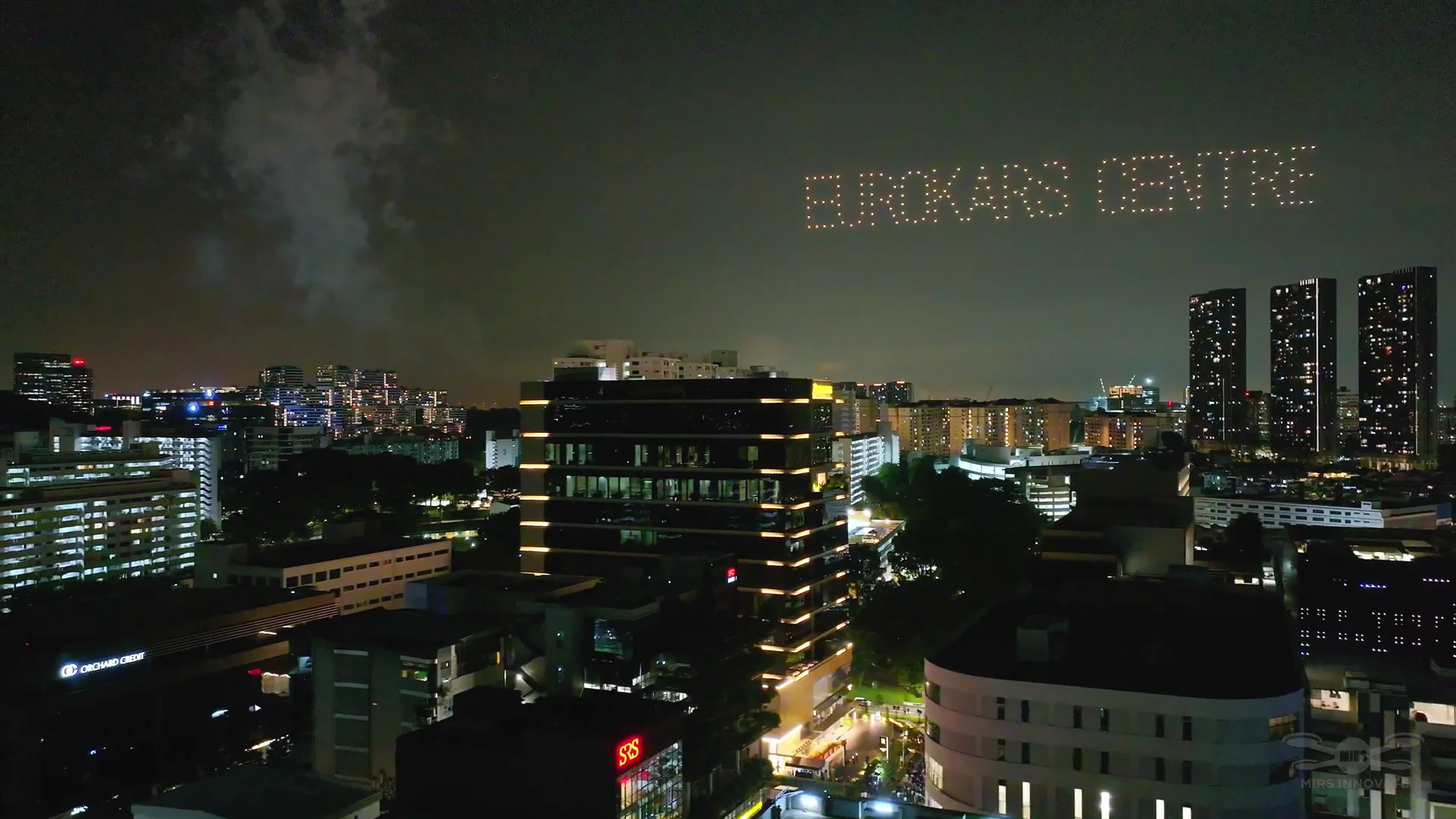 Eurokars Centre text drone formation above Singapore skyline for Eurokars brand promotion