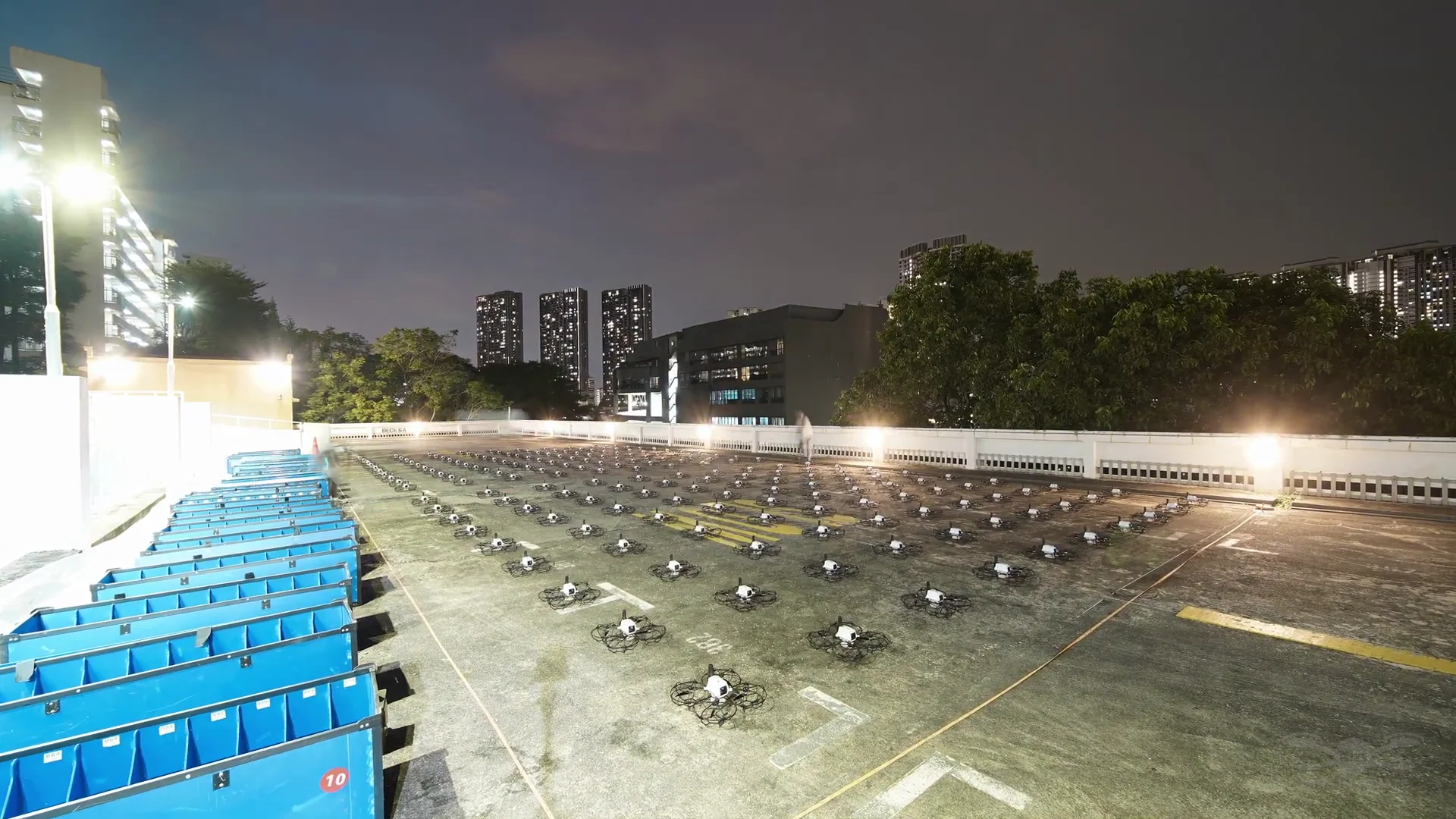 Rooftop drone grid at evening for Eurokars drone show in Singapore