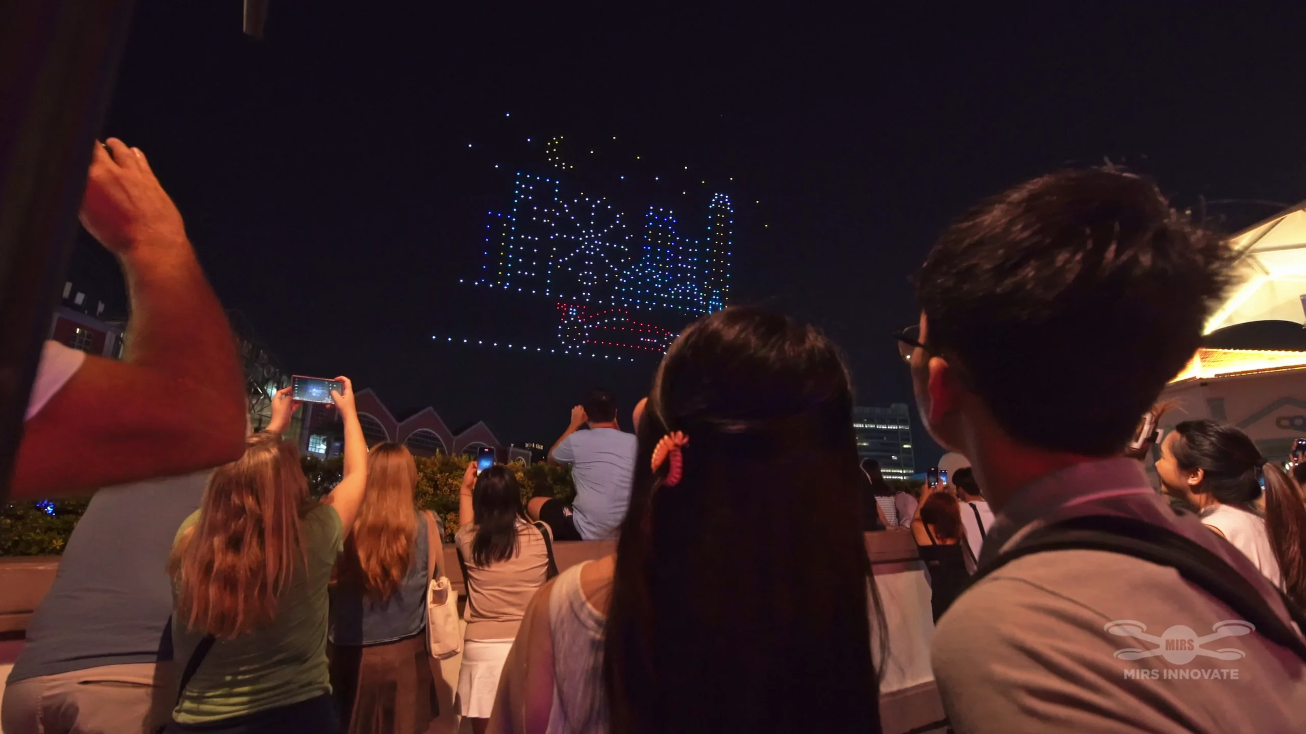 Audience watching F1 CQ drone show skyline formation in Singapore