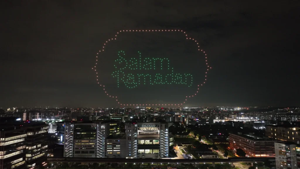 Selamat Raya drone text formation above Geylang Serai Bazaar Raya in Singapore.