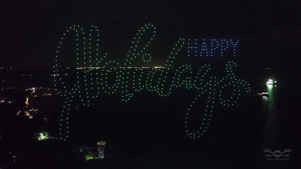 GrabPay Early Christmas Sentosa drone show Singapore - Grabpay Early Christmas Sentosa Happy Holidays Text Formation