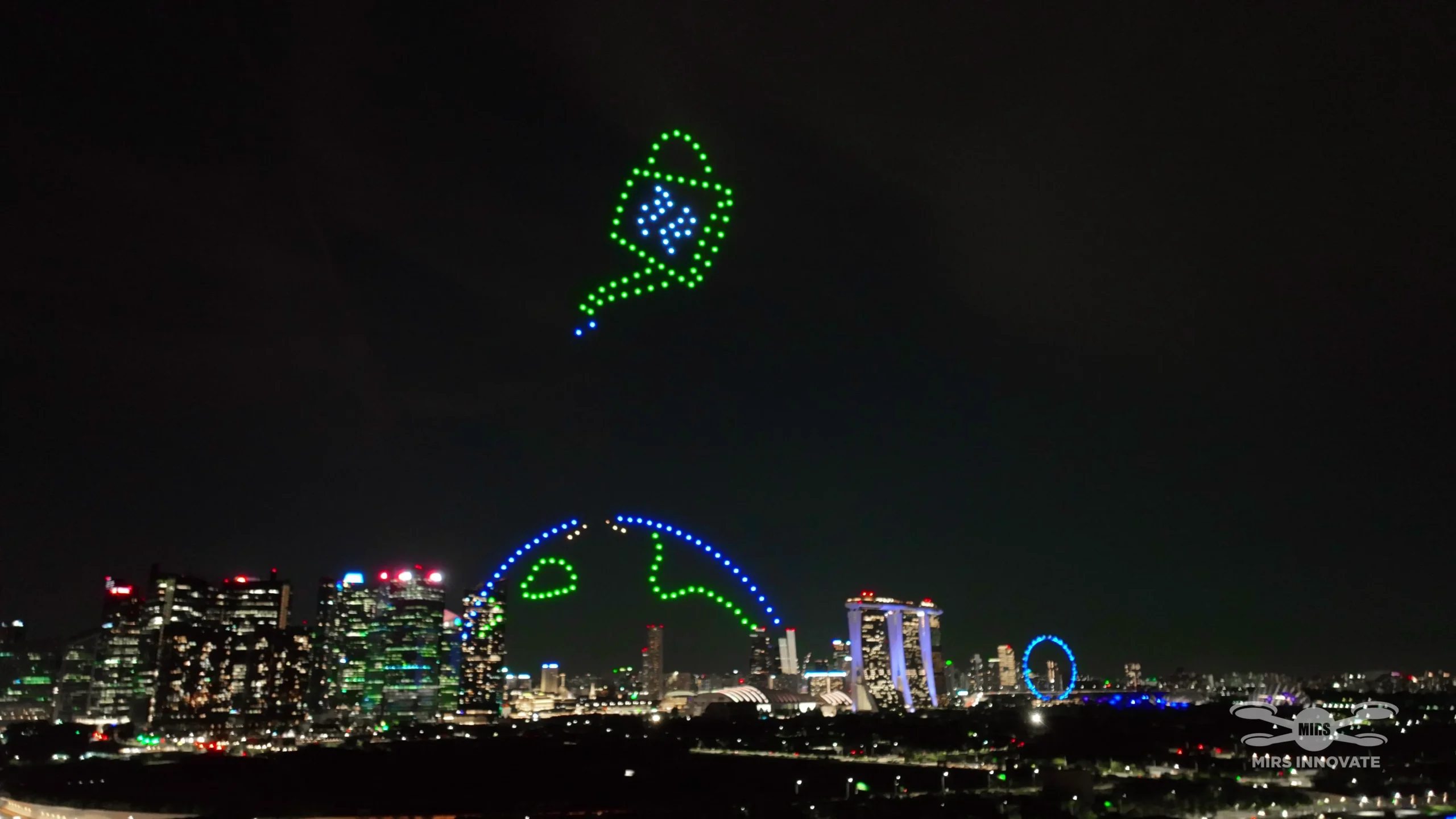 Globe and plant sprout drone formation above the Singapore skyline