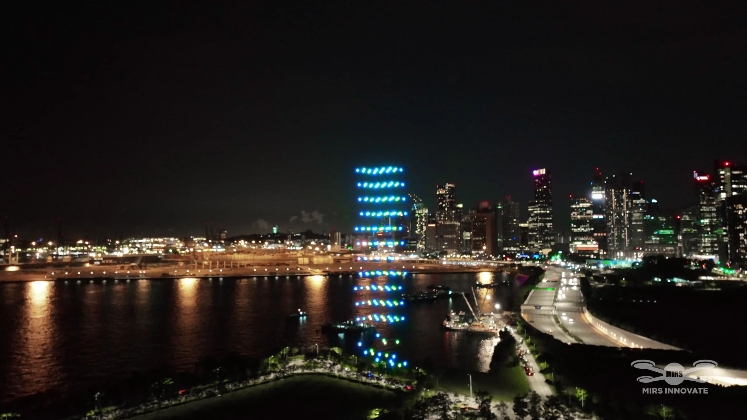 Rainbow vertical drone formation above the Singapore skyline at the IFA Exhibition