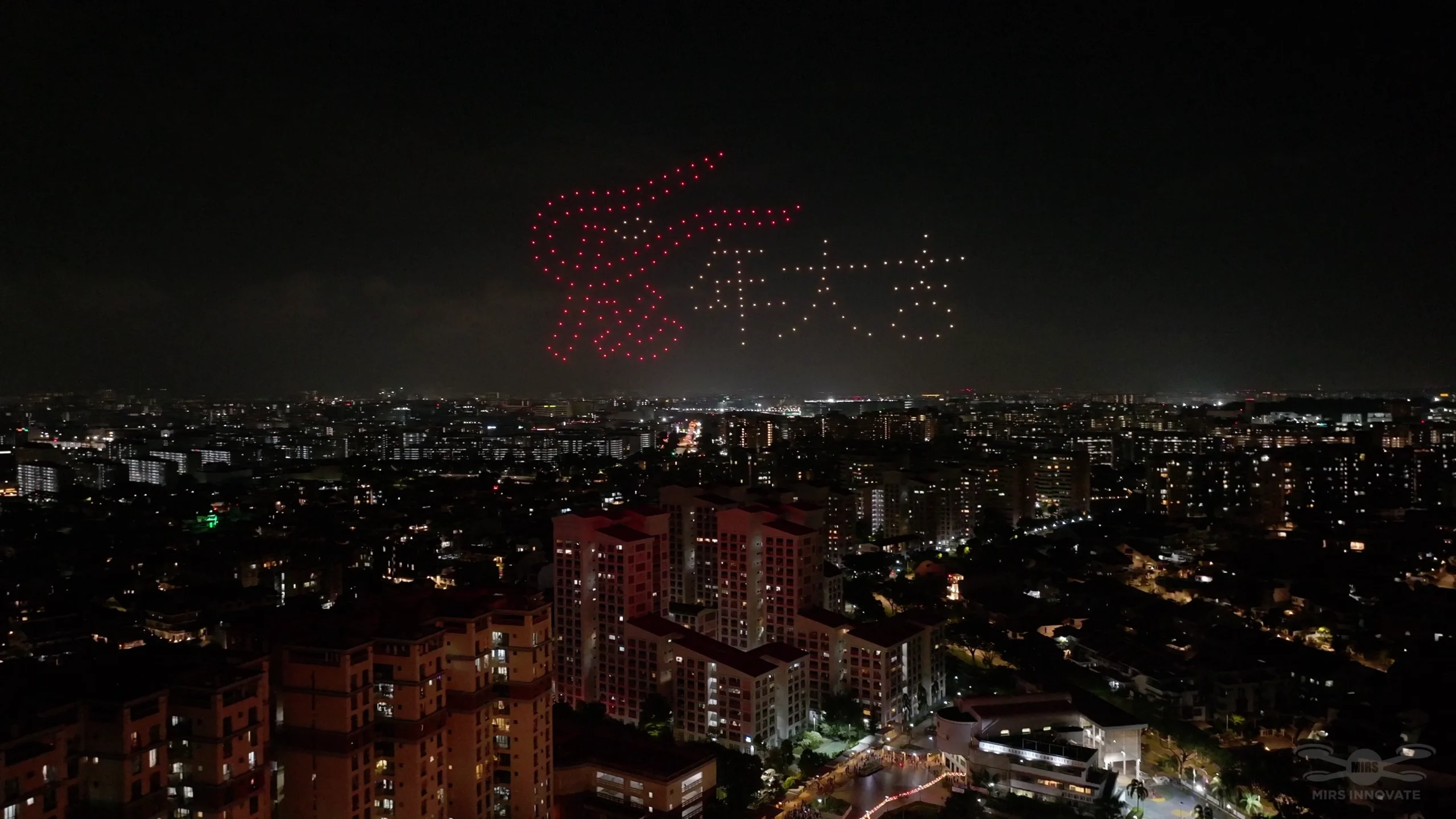 Dragon and Chinese text drone formation at Kampong Kembangan CC