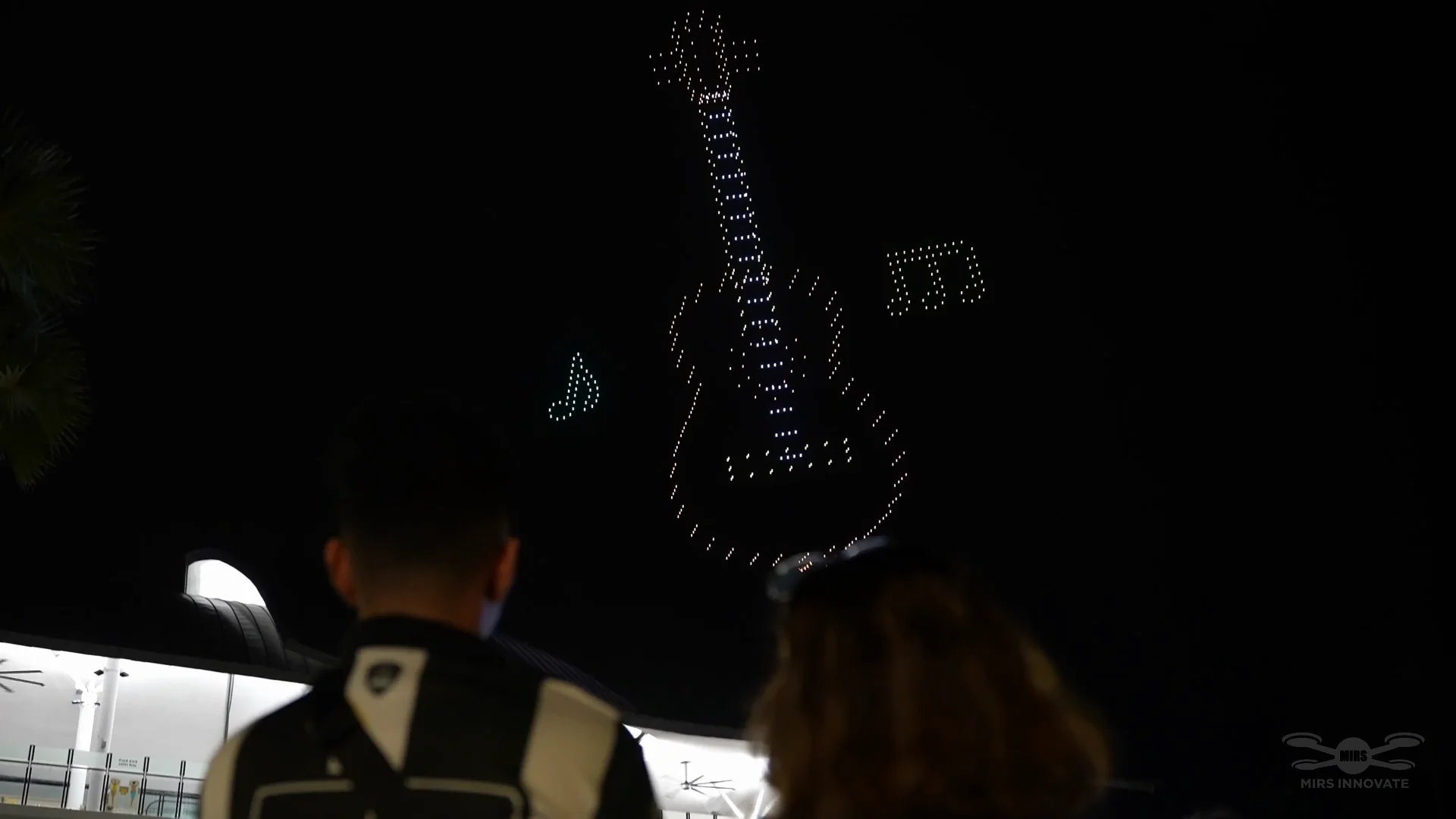 Sentosa New Year Countdown 2023 drone show Singapore - Sentosa New Year Countdown 2023 Audience Watching Guitar Formation