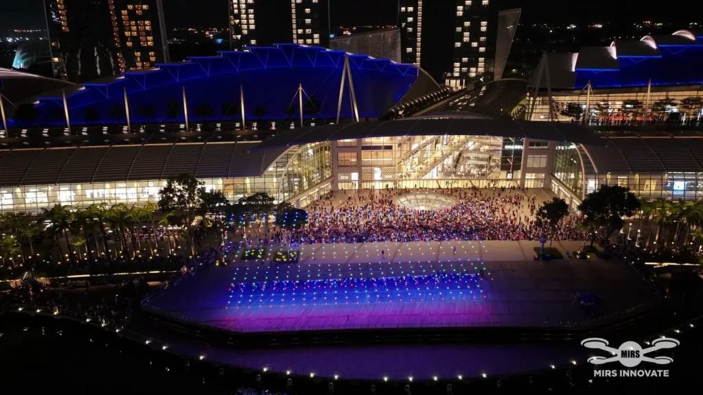 Drone launch grid and crowd outside Marina Bay Sands during the SIEW exhibition in Singapore