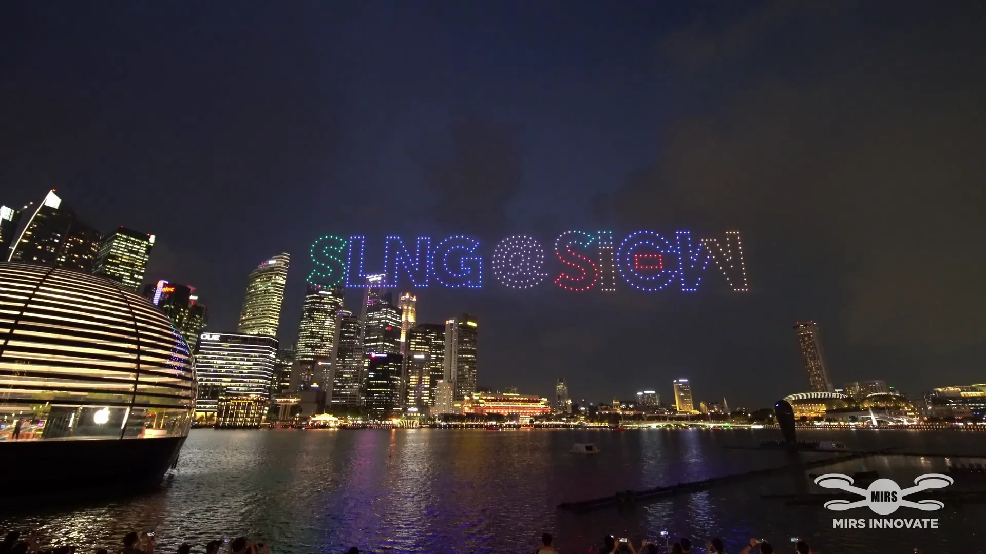 SLNG SIEW text drone formation over the Singapore skyline