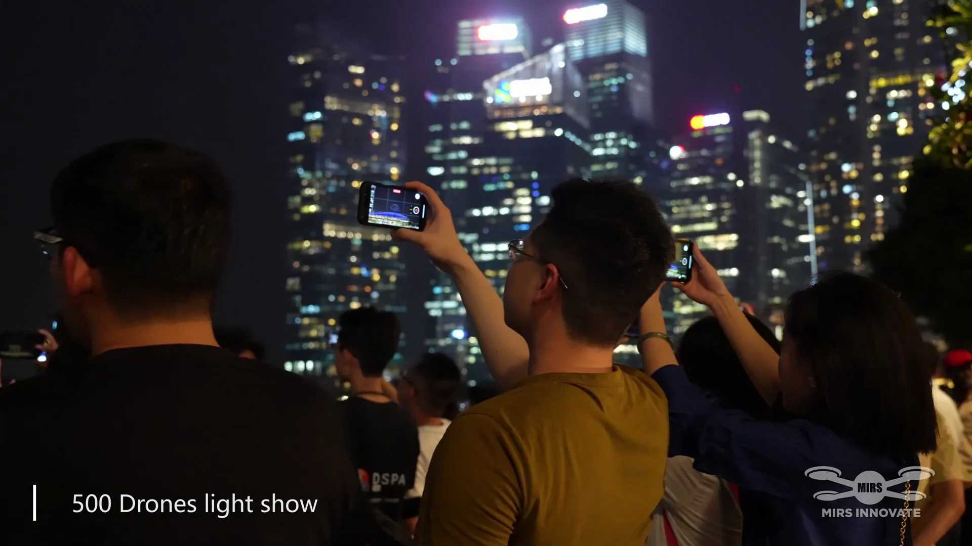 TOKEN 2049 Web3 Exhibition drone show Singapore - Token 2049 Web3 Exhibition Audience Filming City Skyline