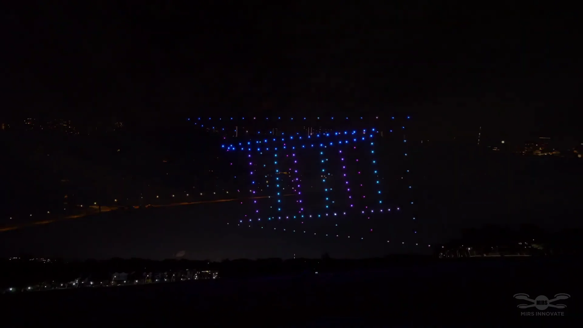 Rectangular light grid formation opening a 150-drone wedding proposal show in Sentosa