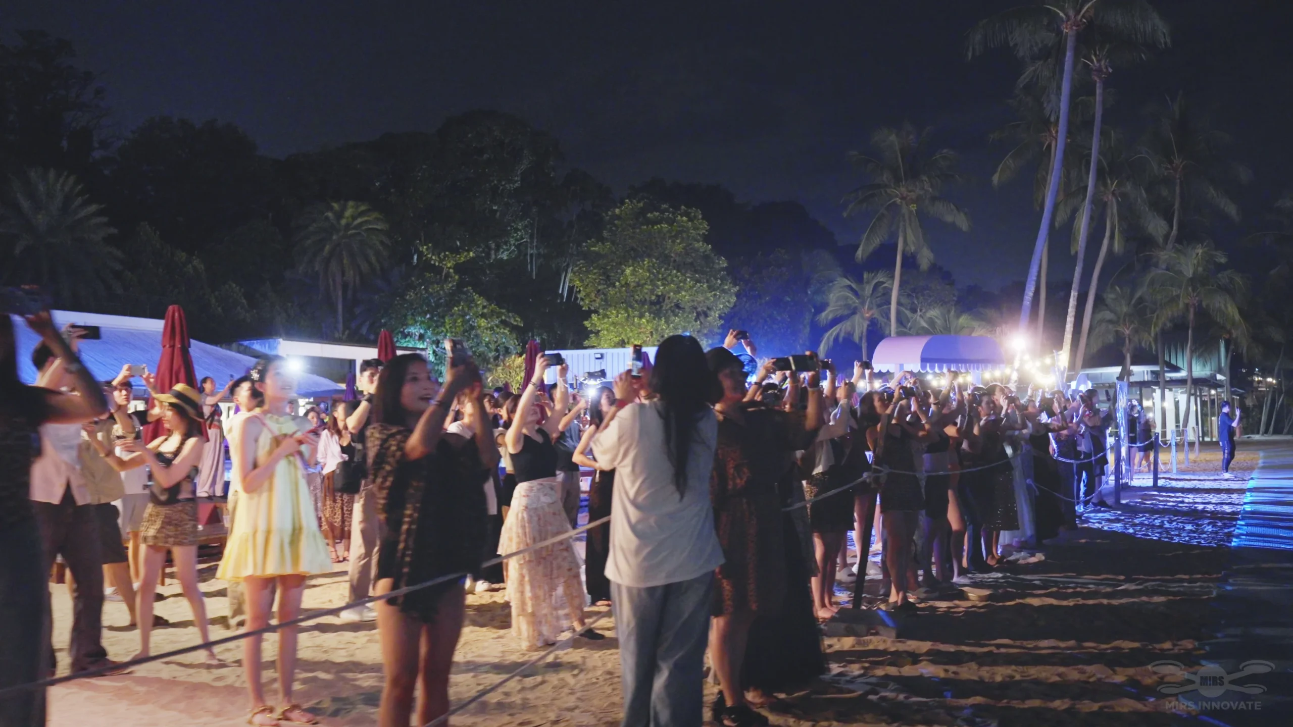 Audience watching the YuanYi 2025 drone show at Siloso Beach Singapore