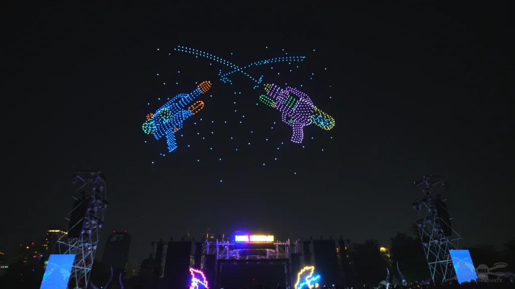 Two colourful water guns spraying water in a playful Songkran drone formation