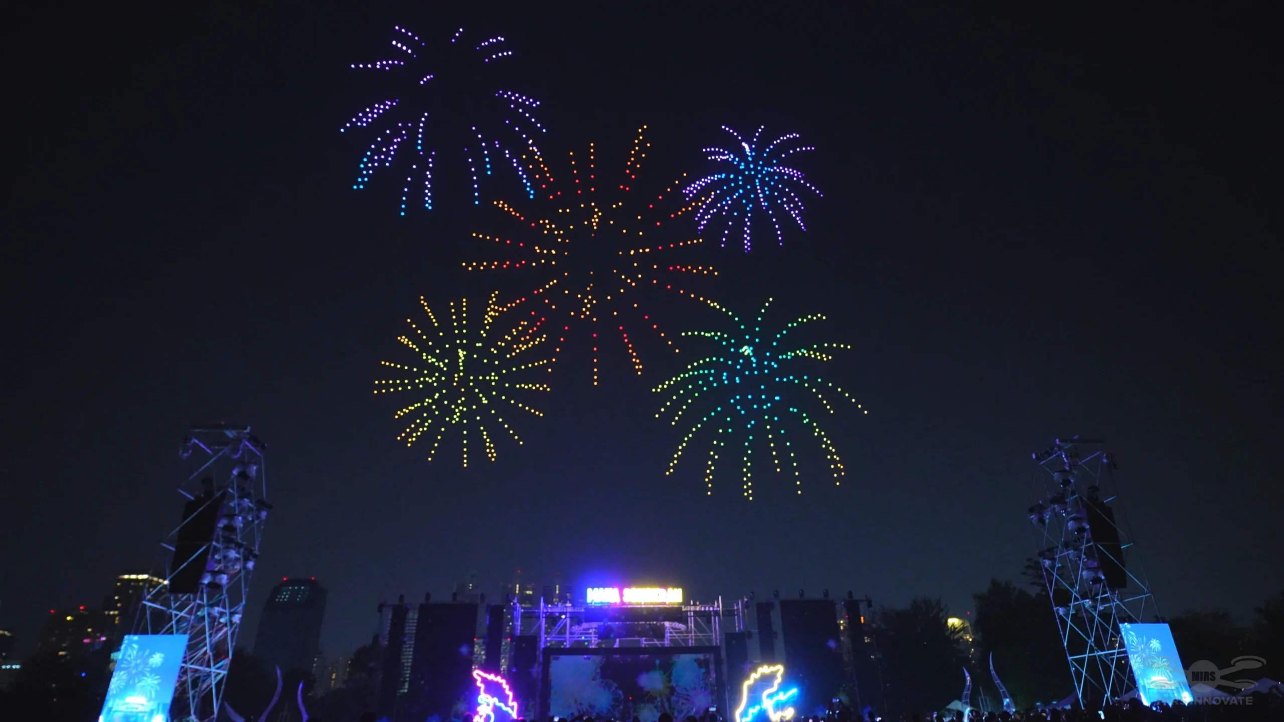 Colourful fireworks-style drone finale above a Songkran festival stage