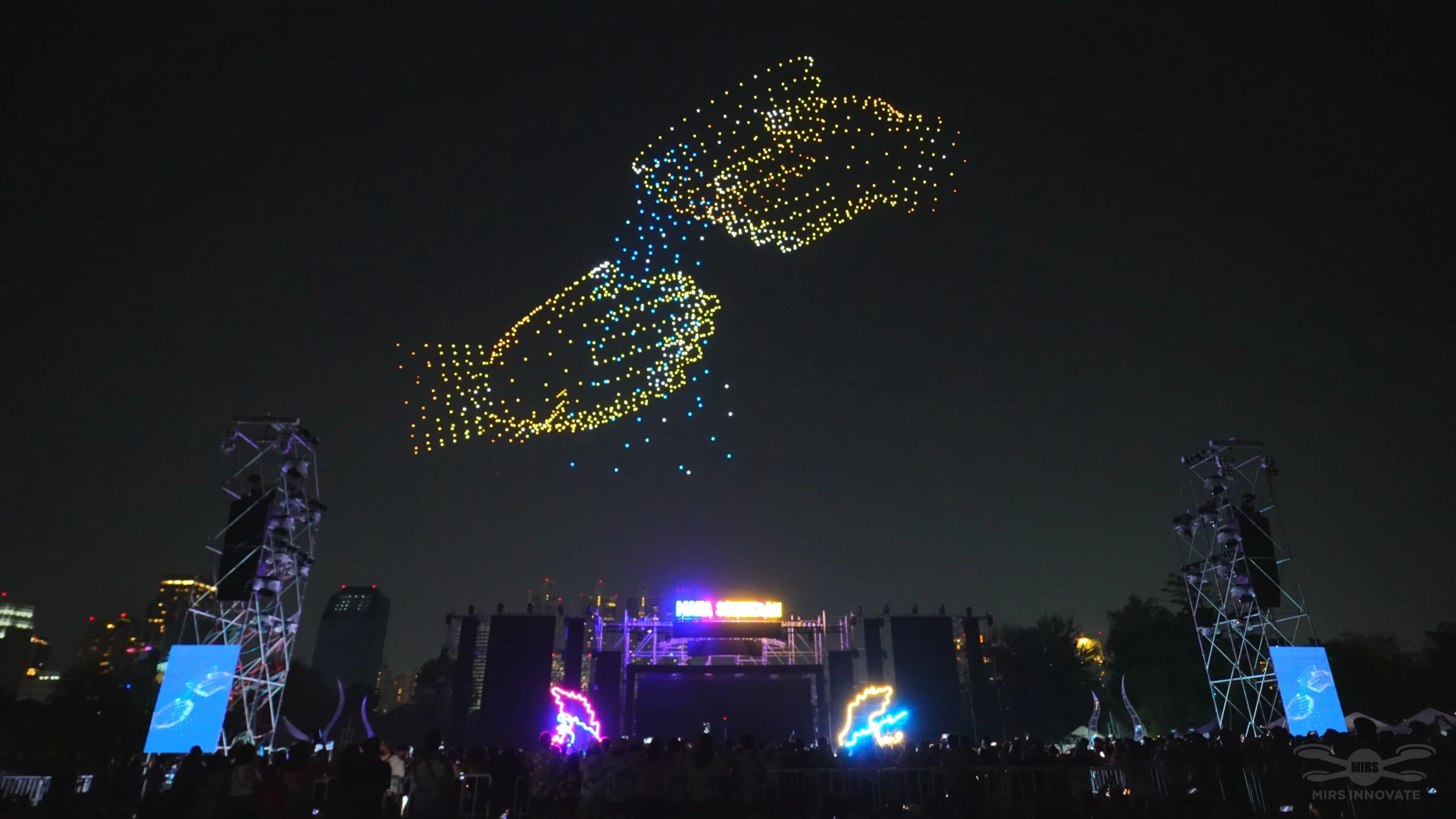 Twin fish drone formation above a Thailand festival stage