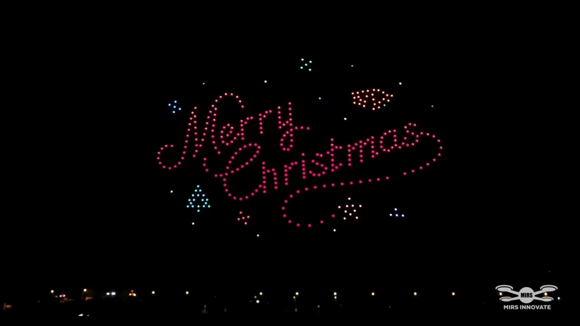 Merry Christmas text and gift boxes formed by drones during the China Christmas celebration