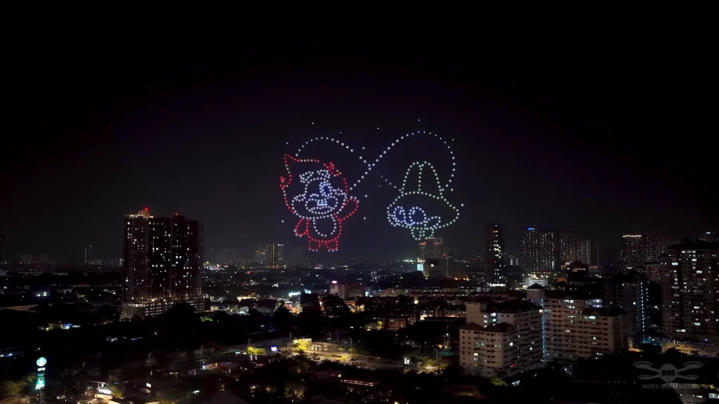 HFM Solar and Luna mascot drone formations over the Kuala Lumpur skyline