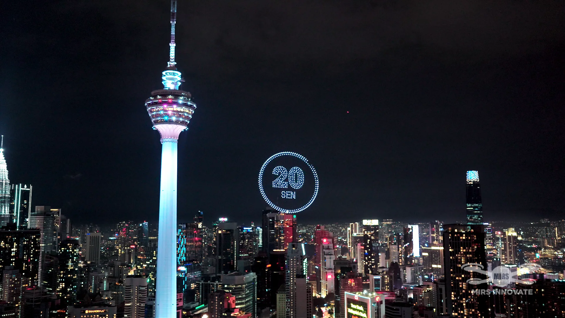 20 sen coin formation above the Kuala Lumpur skyline beside KL Tower at the McDonald's Malaysia Prosperity 2025 drone show