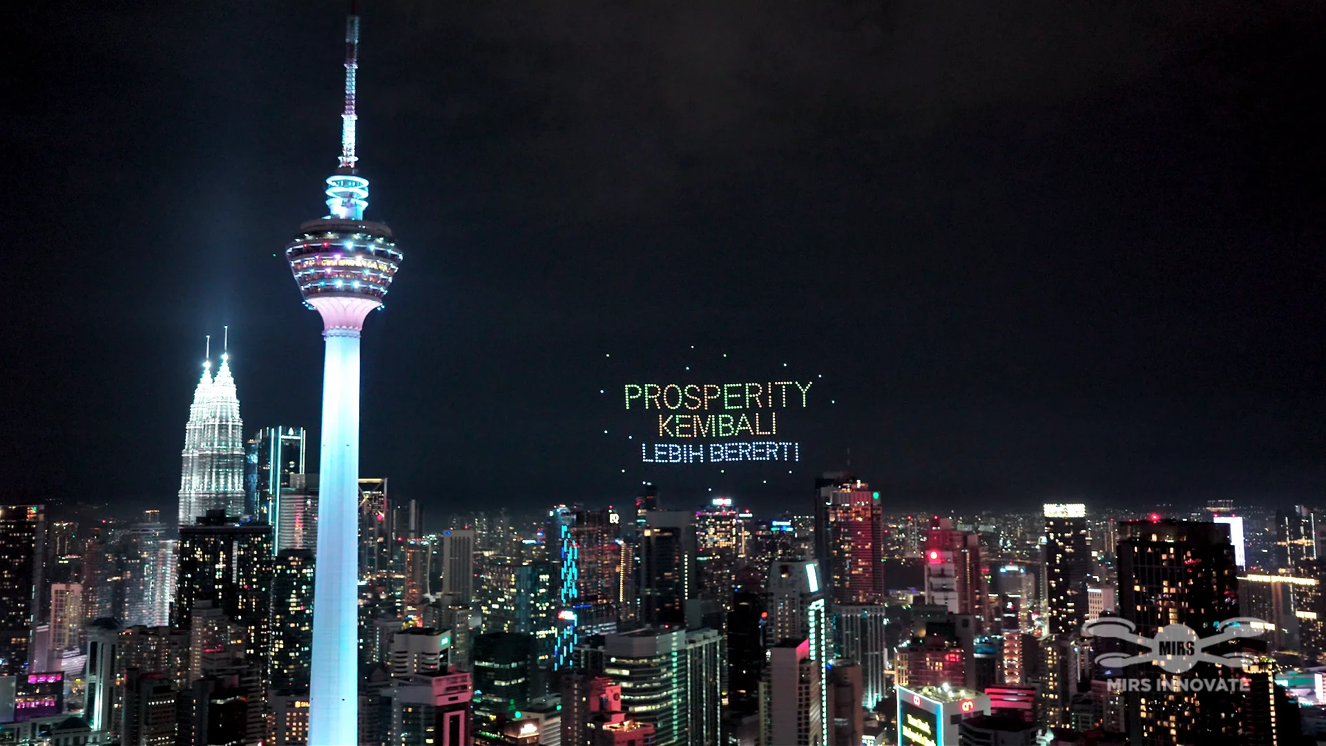 Prosperity Kembali Lebih Bererti text formation above Kuala Lumpur beside KL Tower at the McDonald's Malaysia drone show