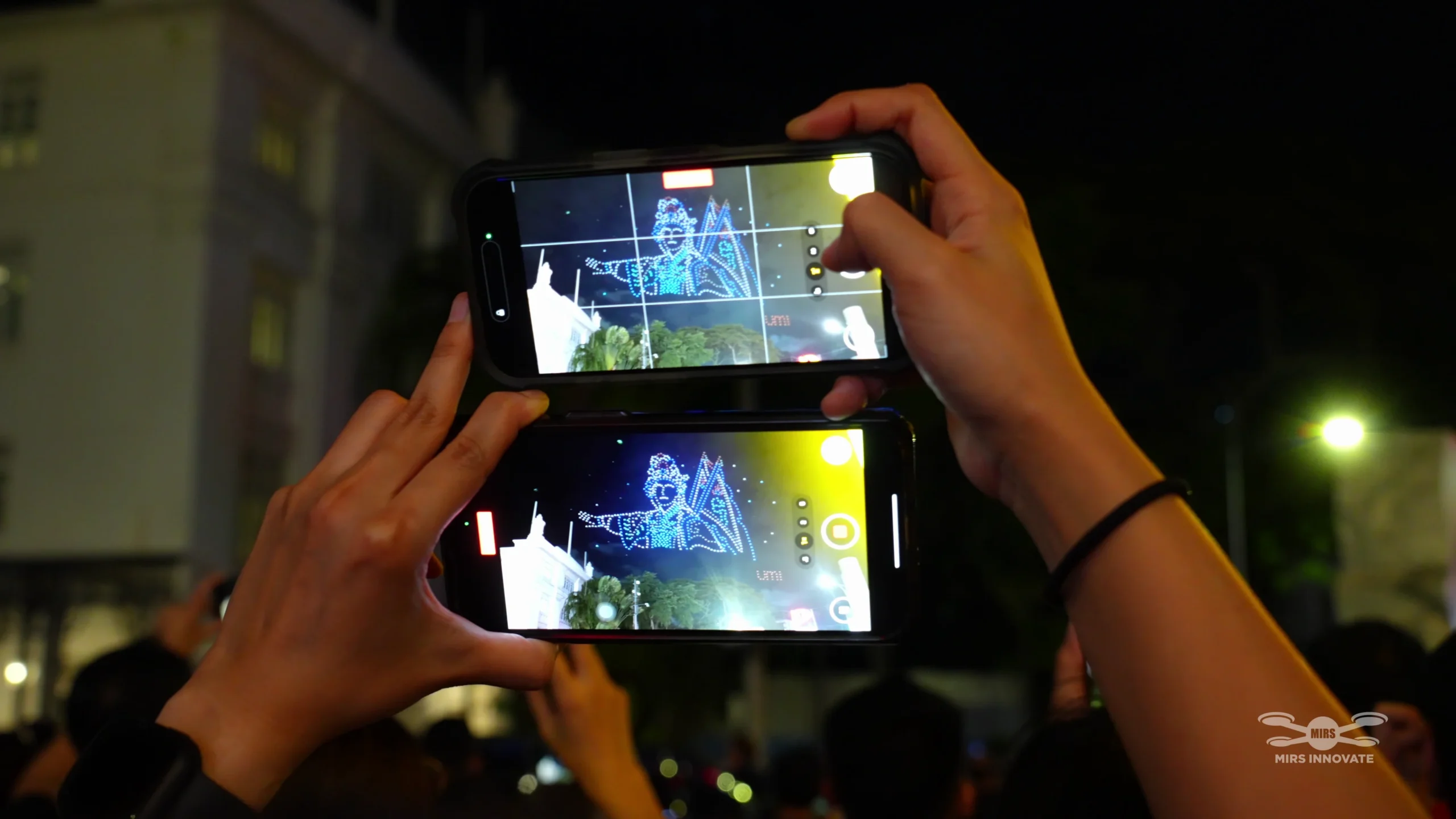 Audience recording a traditional character drone formation at the Umi Umi Penang launch