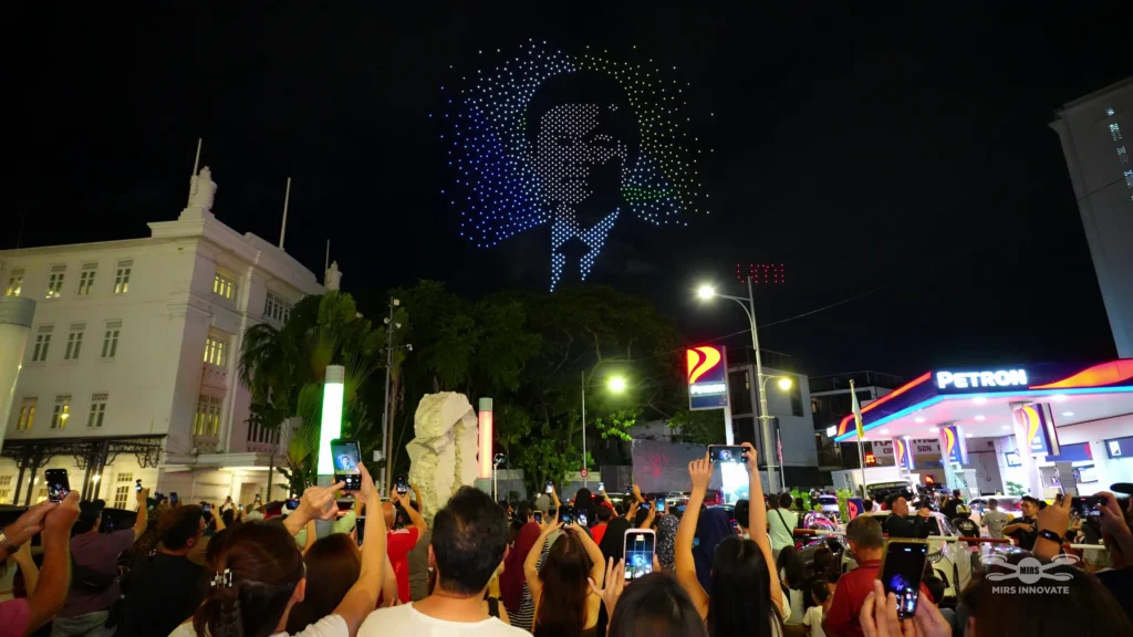 Audience watching a branded character drone formation in Penang, Malaysia