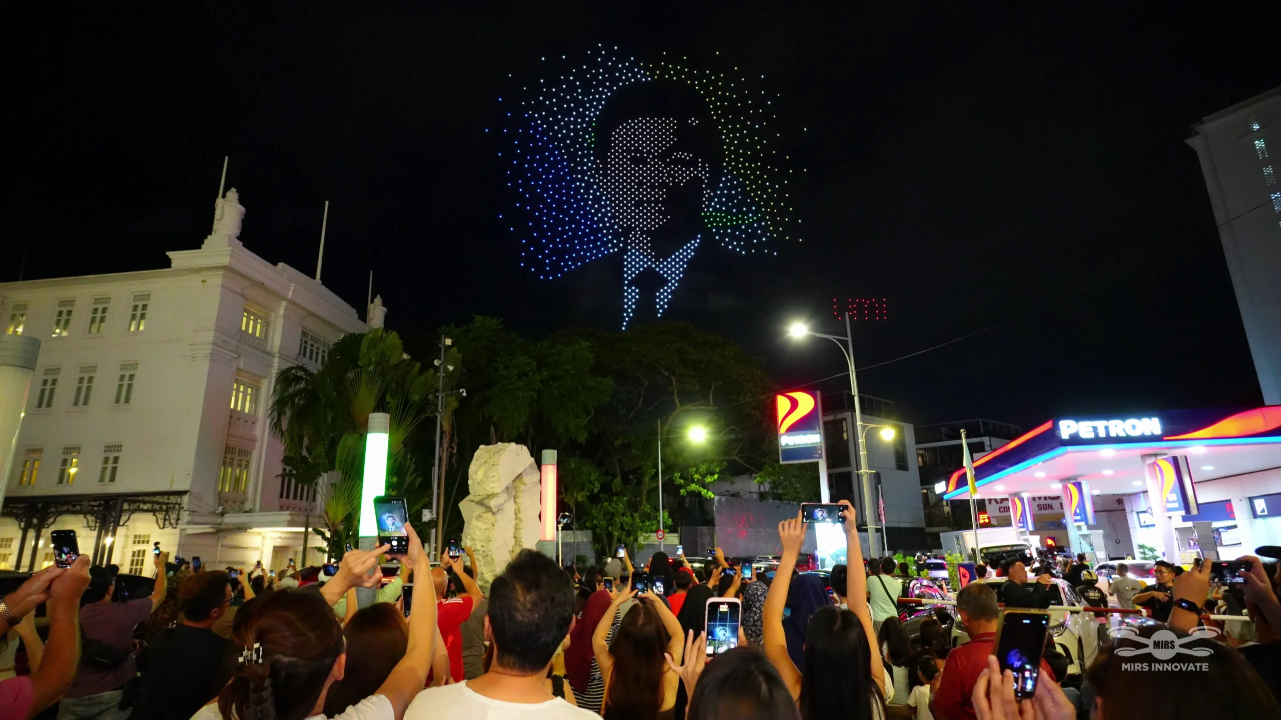 Audience watching the Umi Umi character with bow drone formation in Penang