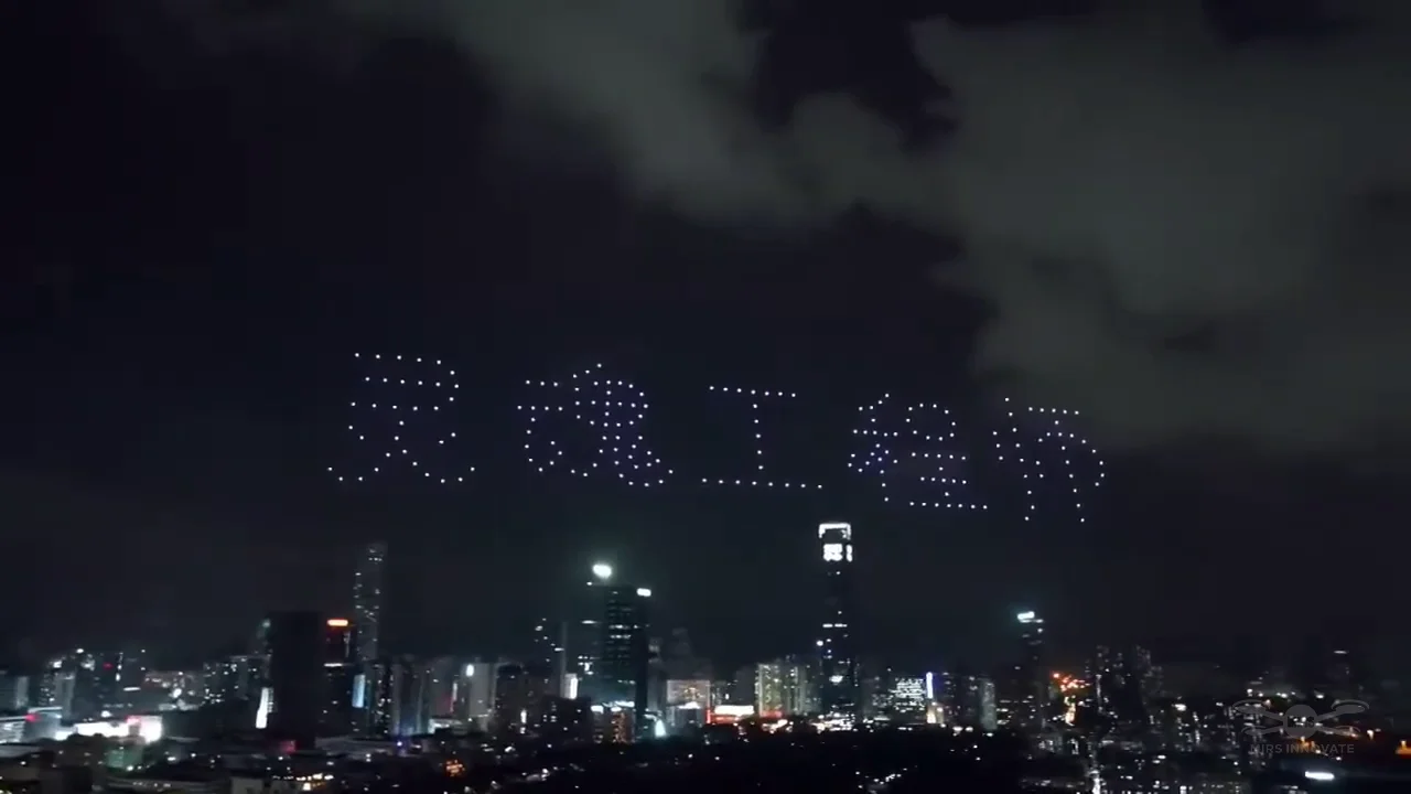 Chinese proposal text formed by 200 drones above an overseas cityscape